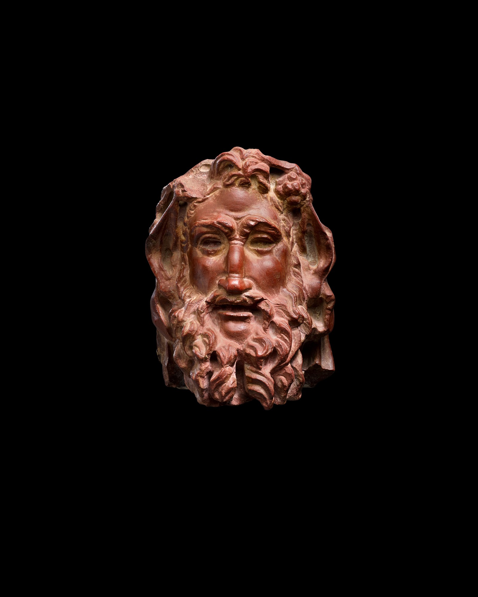 A Rosso Antico Marble Herm Head of a Satyr — A Rosso Antico Marble Herm Head of a Satyr, circa 2nd Century A.D.