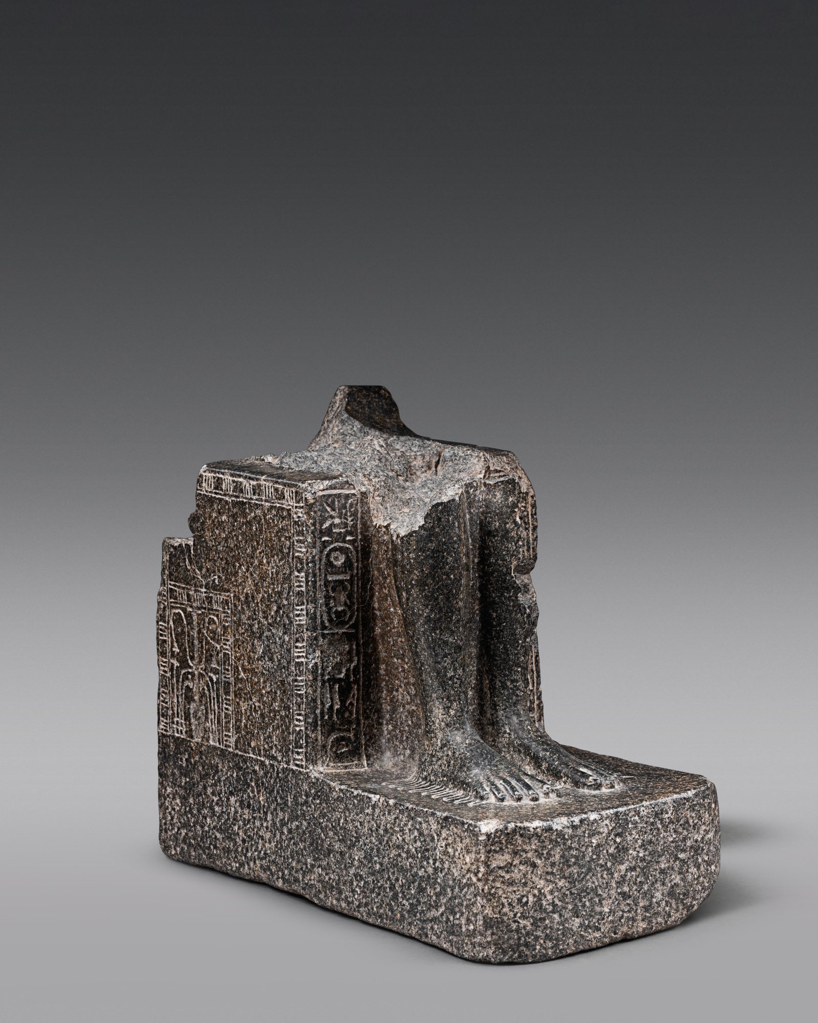 A Fragmentary Egyptian Granite Figure of Tuthmosis III — A Fragmentary Egyptian Granite Figure of Tuthmosis III, 18th Dynasty, reign of Tuthmosis III, 1479-1426 B.C.