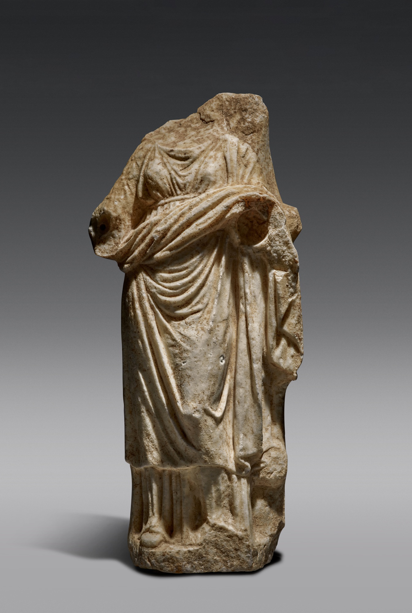 A Greek Marble Figure of a Goddess — A Greek Marble Figure of a Goddess, mid 4th Century B.C.