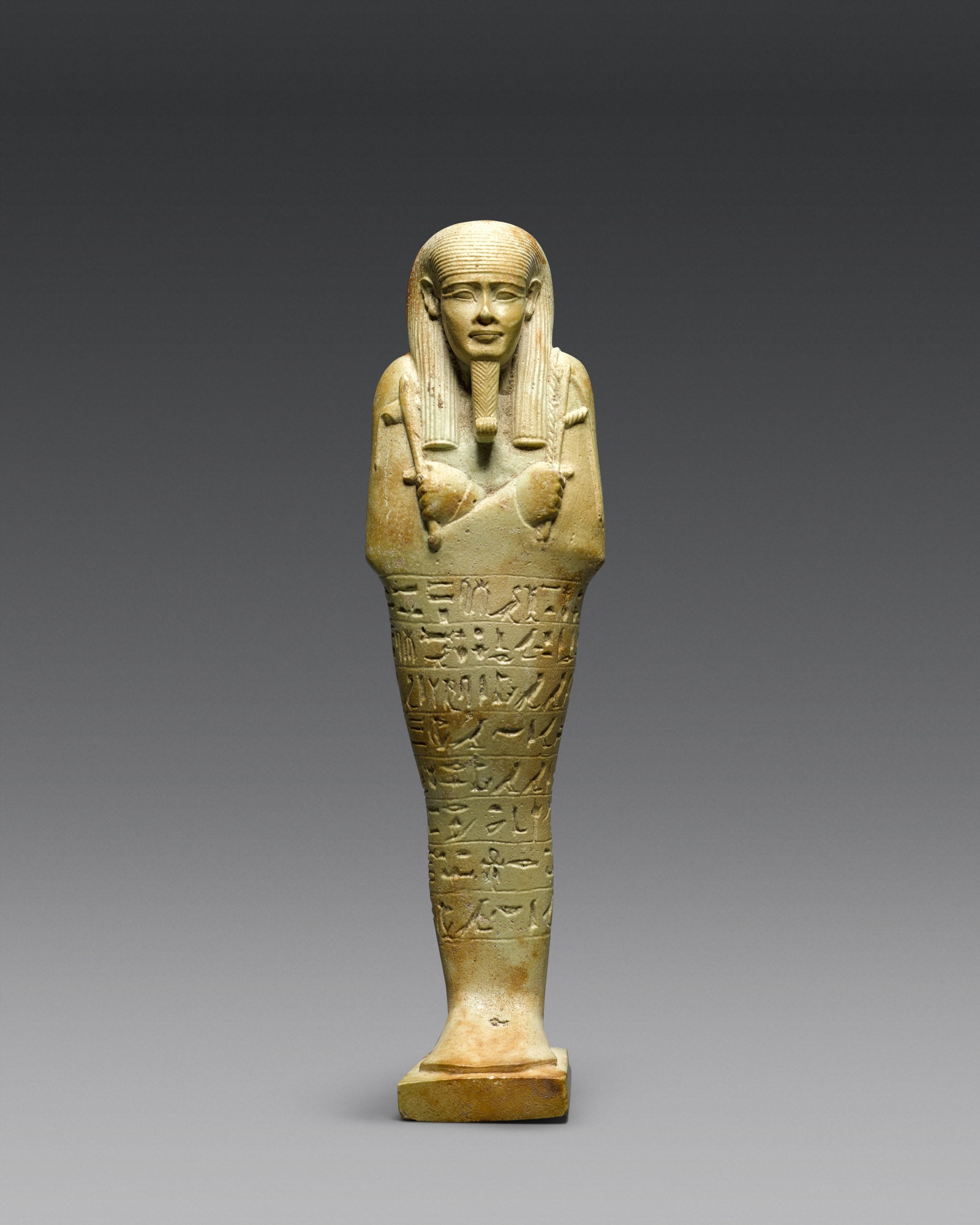 An Egyptian Pale Blue-green Ushabti of Neferibresaneith — An Egyptian Pale Blue-green Ushabti of Neferibresaneith, 26th Dynasty, period of Amasis, 570-526 B.C.