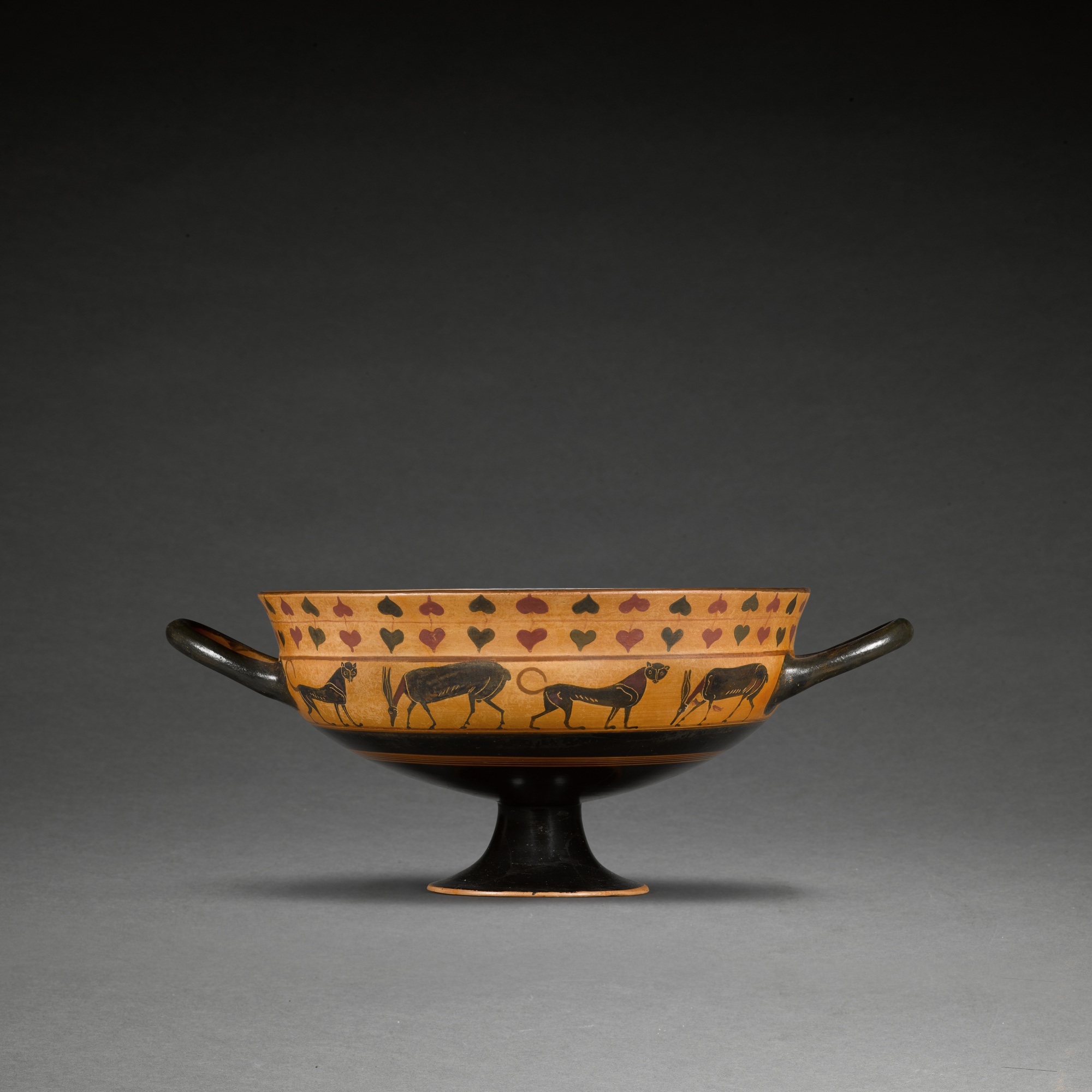 An Attic Black-figured Siana Cup — An Attic Black-figured Siana Cup, attributed to the Taras Painter, the tondo perhaps by the Malibu painter, circa 560-550 B.C.