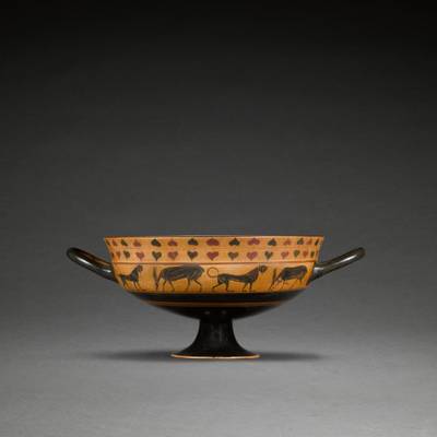 An Attic Black-figured Siana Cup, attributed to the Taras Painter, the tondo perhaps by the Malibu painter, circa 560-550 B.C.