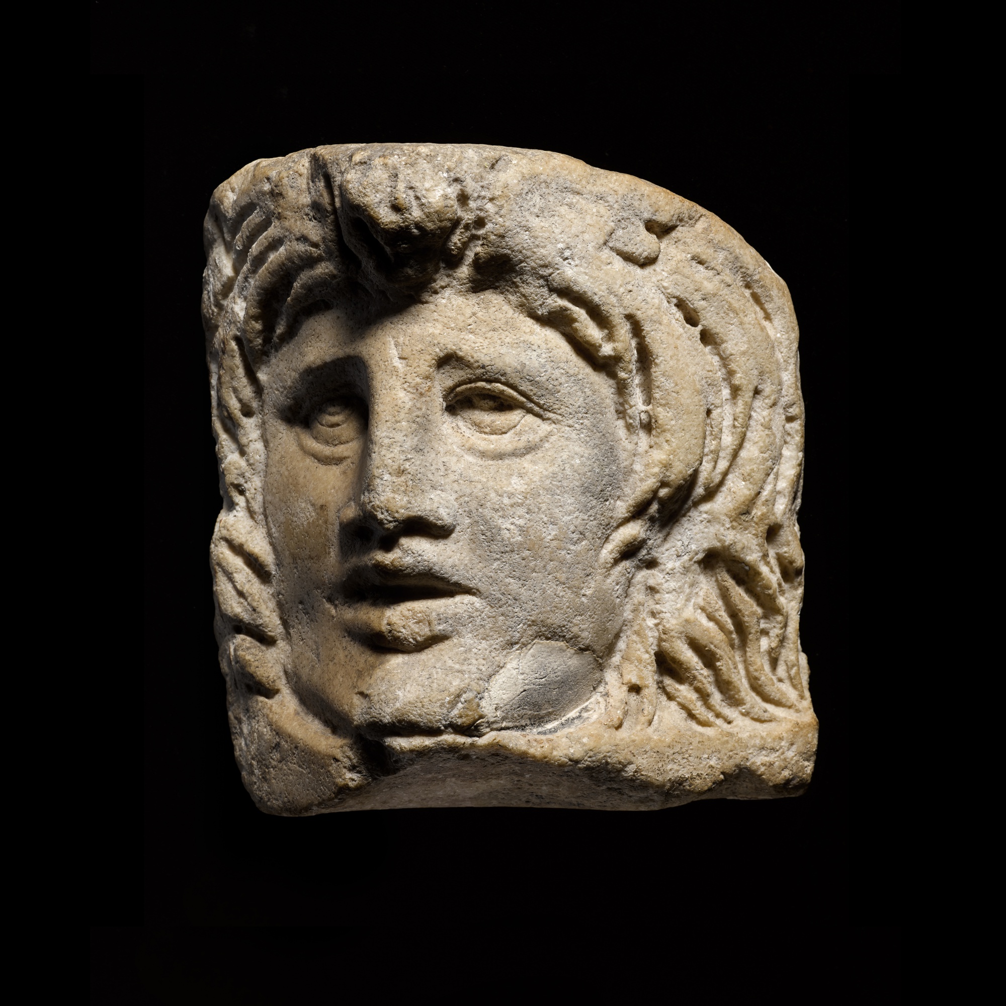 A Roman Marble Relief Theatre Mask, 3rd Century A.D. — A Roman Marble Relief Theatre Mask, 3rd Century A.D.