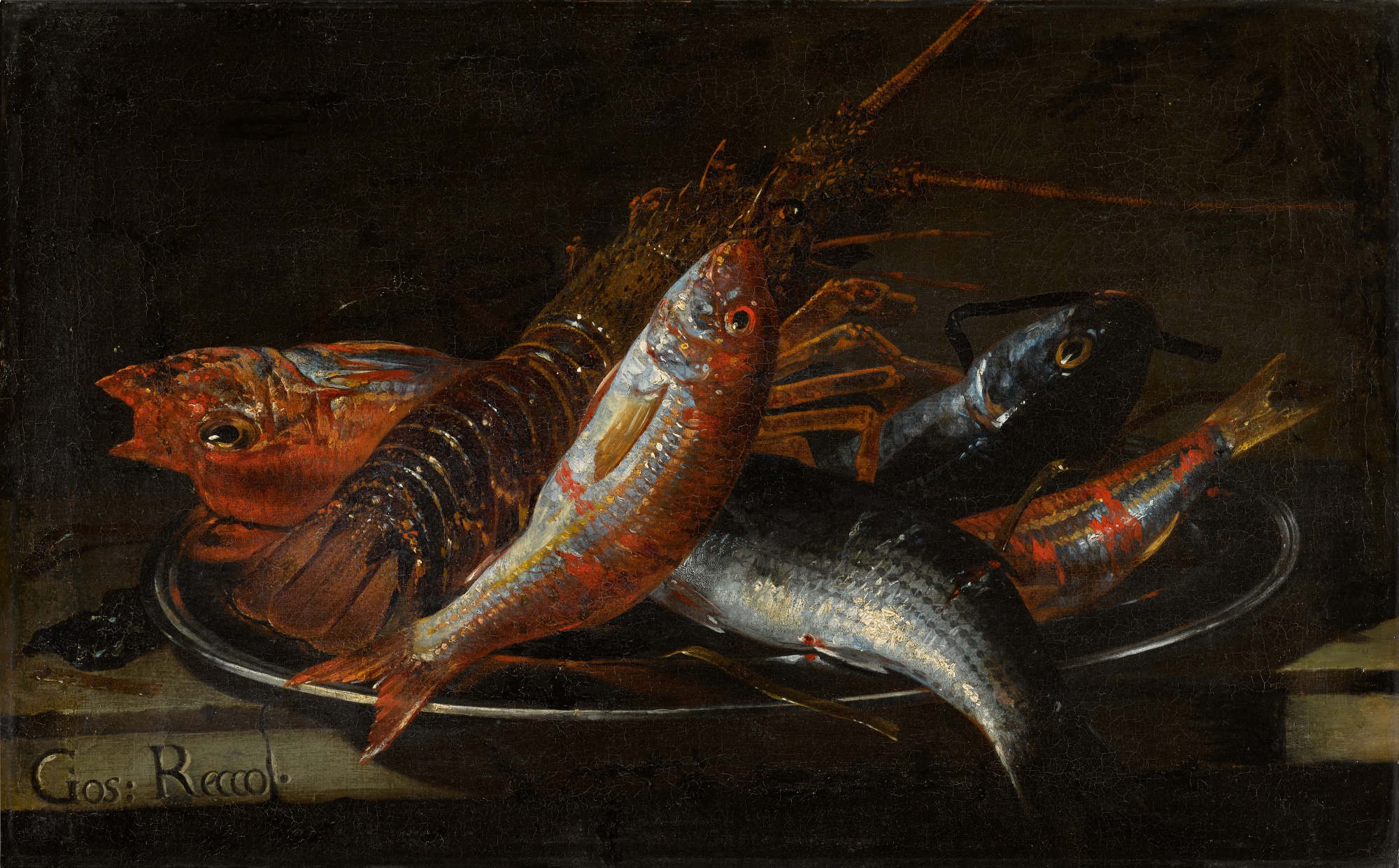 Still life of fish and a lobster on a platter, on a stone ledge