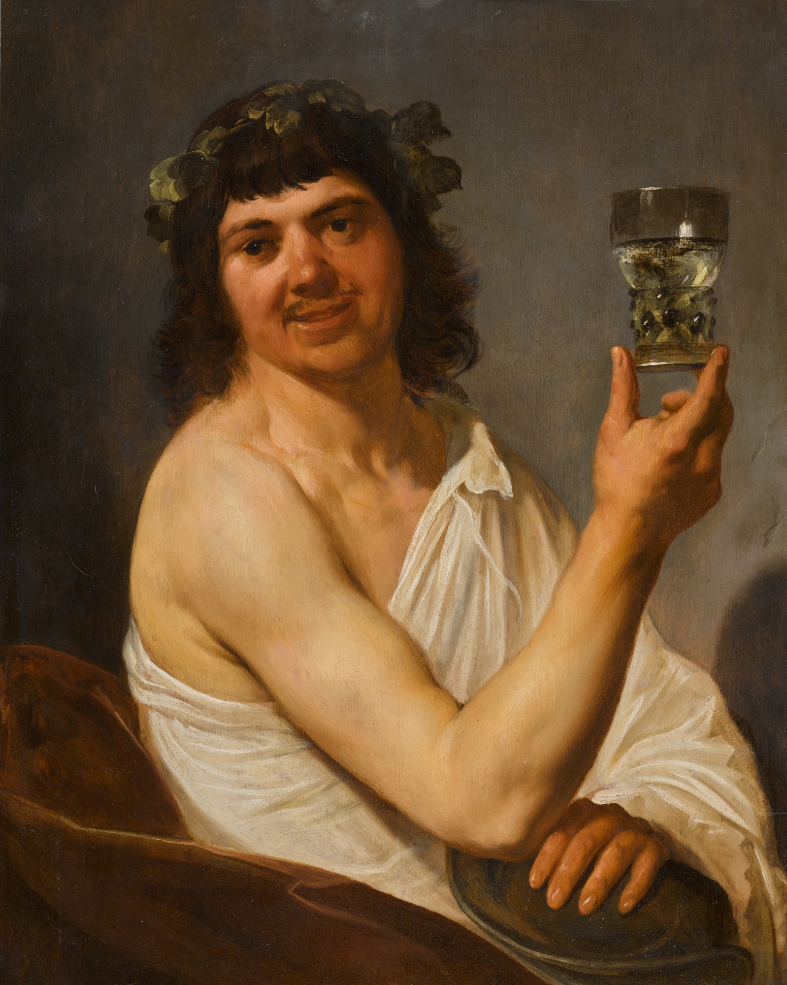 Christian van Couwenbergh — Portrait of a man, half-length, in the guise of Bacchus holding a drinking vessel