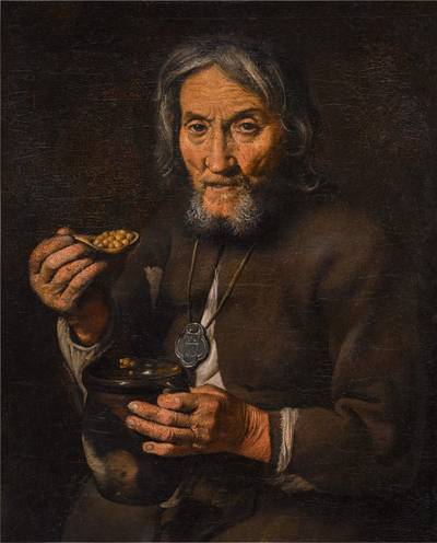 A man eating chickpeas