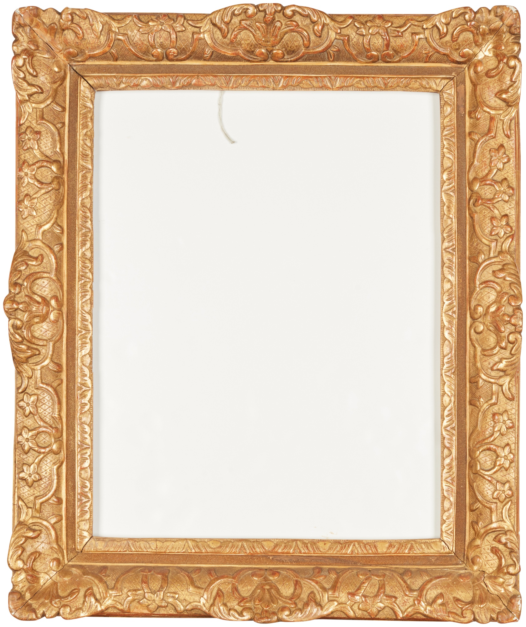 A Louis XIV carved giltwood frame — A Louis XIV carved giltwood frame
