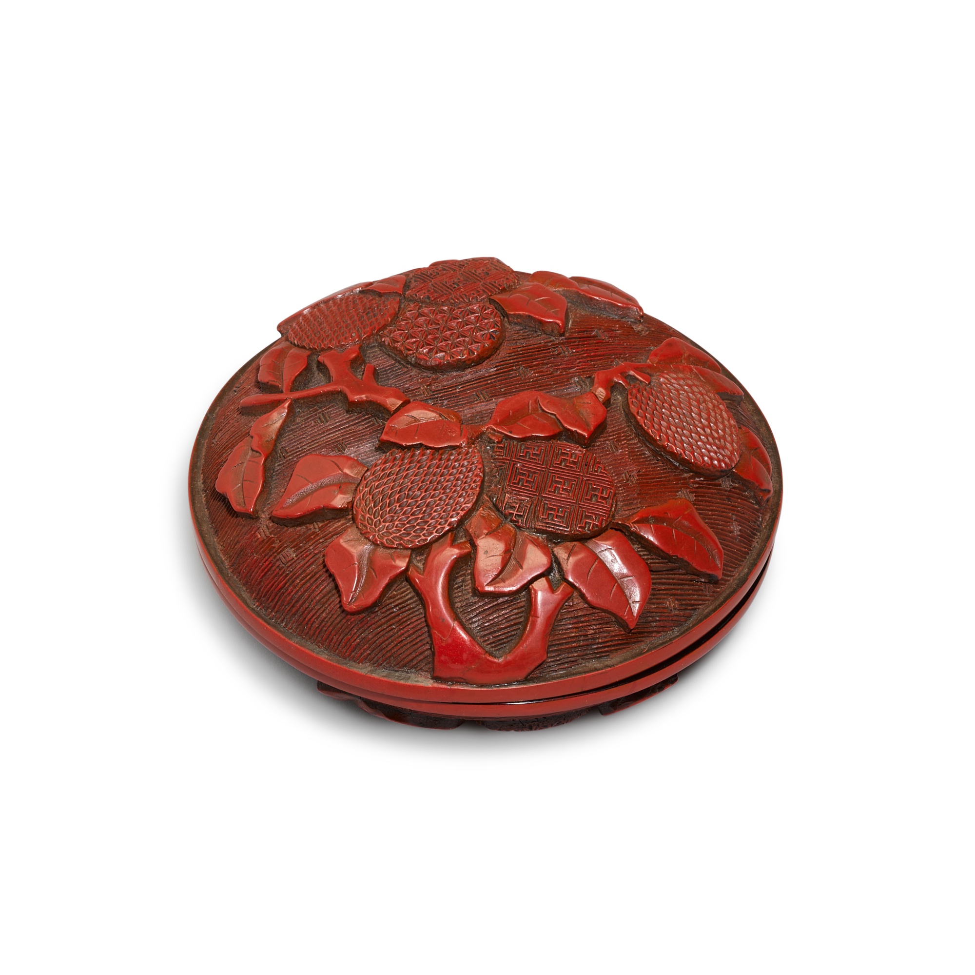 A carved cinnabar lacquer box and cover, Ming dynasty, 16th century — A carved cinnabar lacquer box and cover, Ming dynasty, 16th century