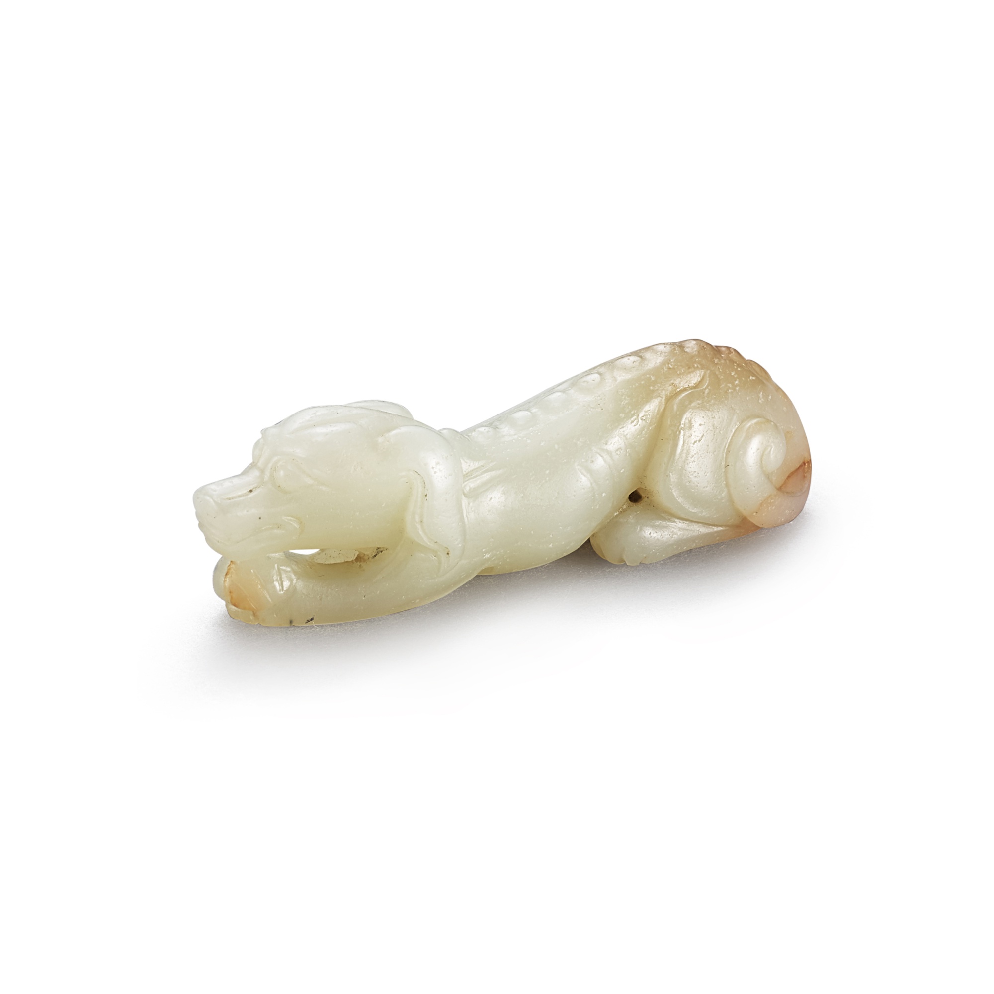 A celadon jade figure of a dog, Ming dynasty — A celadon jade figure of a dog, Ming dynasty