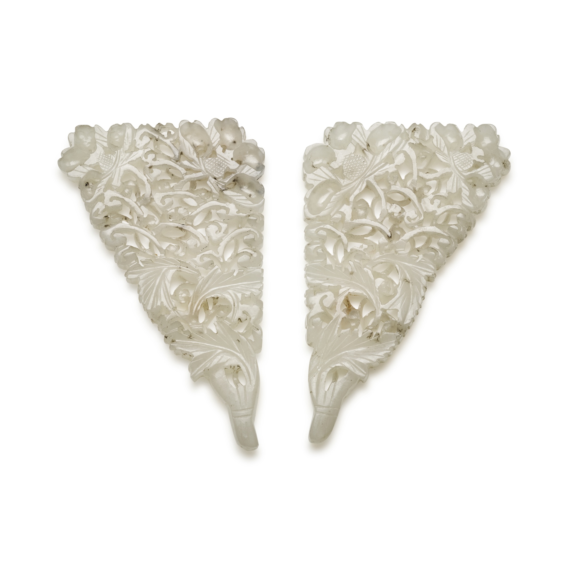 Unknown (Historical) — A pair of reticulated celadon jade ornaments, 19th / 20th century