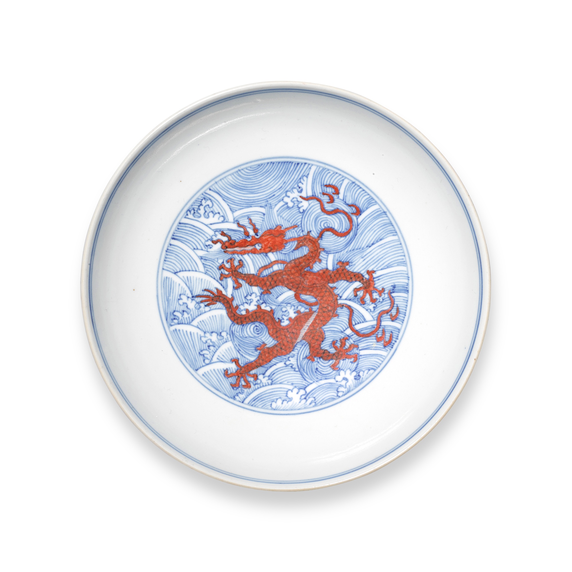An iron-red and underglaze-blue 'dragon' dish, — An iron-red and underglaze-blue 'dragon' dish, Seal mark and period of Daoguang 