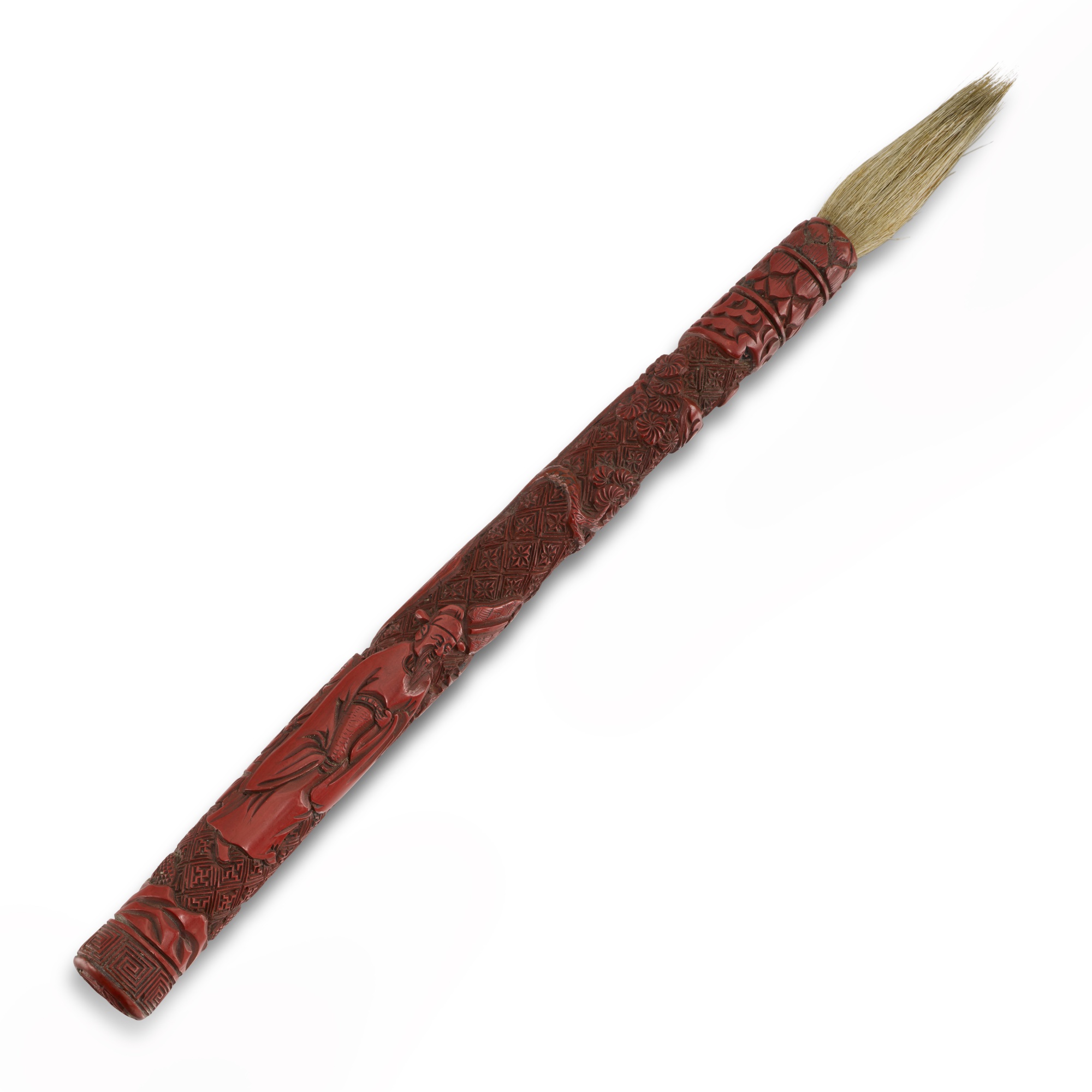 A carved cinnabar lacquer ‘figural' brush, — A carved cinnabar lacquer ‘figural' brush, Ming dynasty, 16th century 