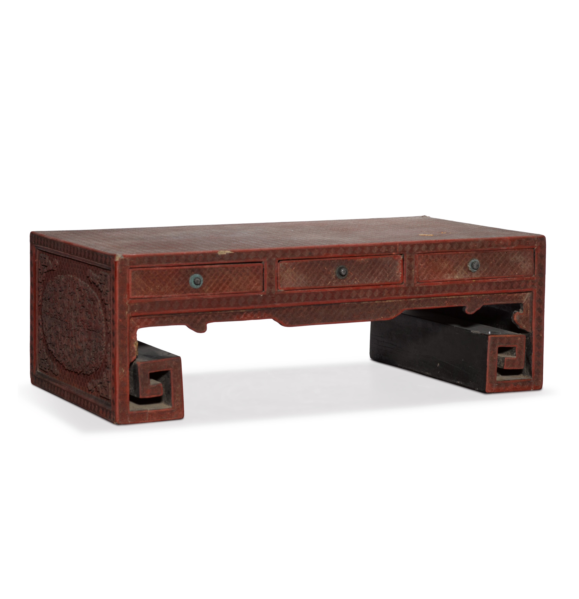 A carved cinnabar lacquer Kang table, — A carved cinnabar lacquer Kang table, Qing dynasty, Qianlong / Jiaqing period 
