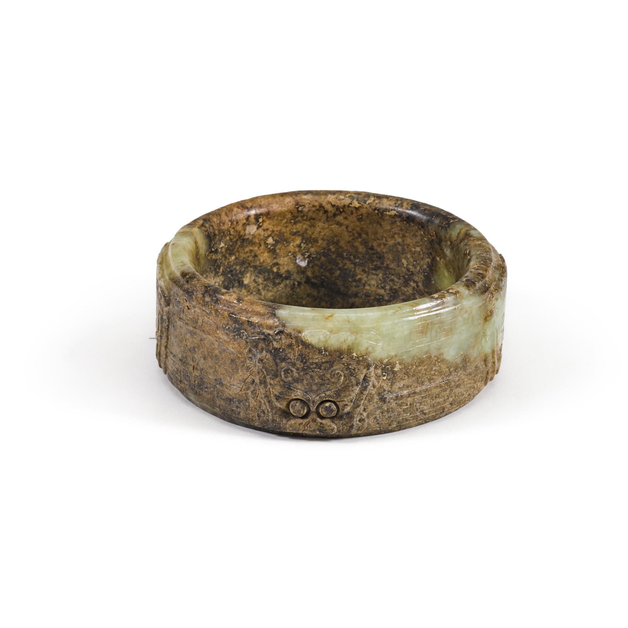 An archaistic brown and celadon jade 'taotie' ring, — An archaistic brown and celadon jade 'taotie' ring, Song - Ming dynasty 