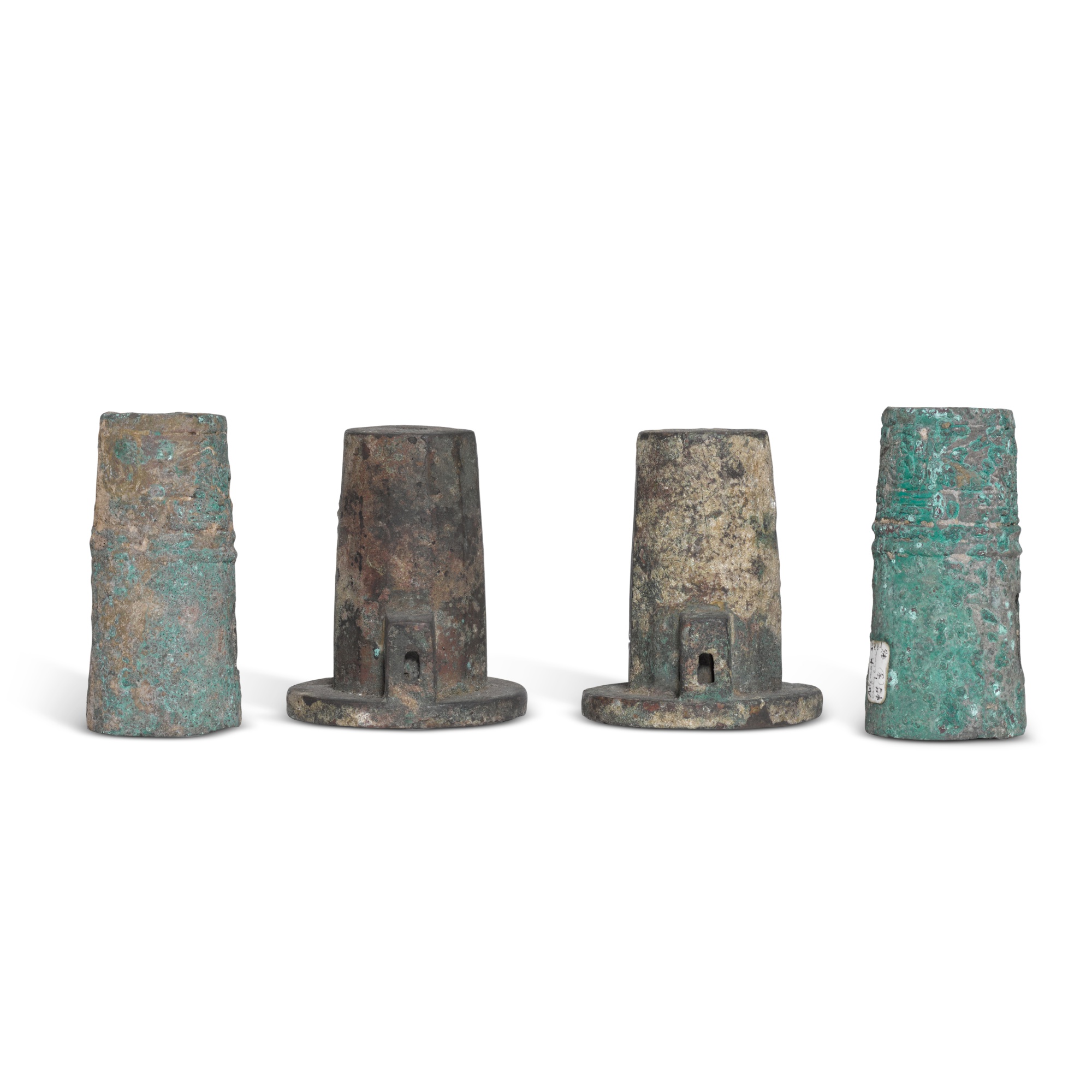 A group of archaic bronze chariot fittings, — 周 青銅車馬飾 一組四件