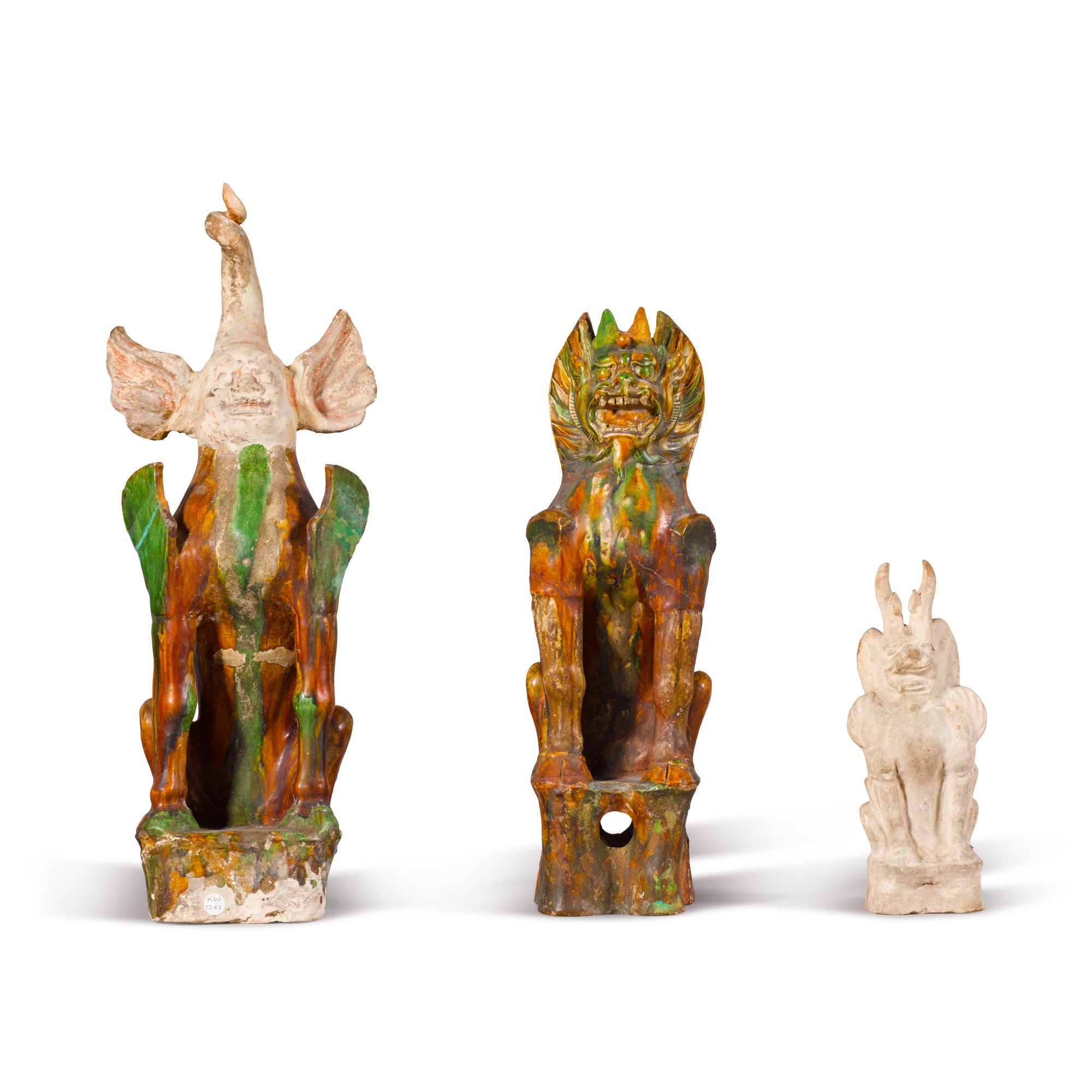 A group of three pottery earth spirits, — 唐 陶鎮墓獸 一組三件