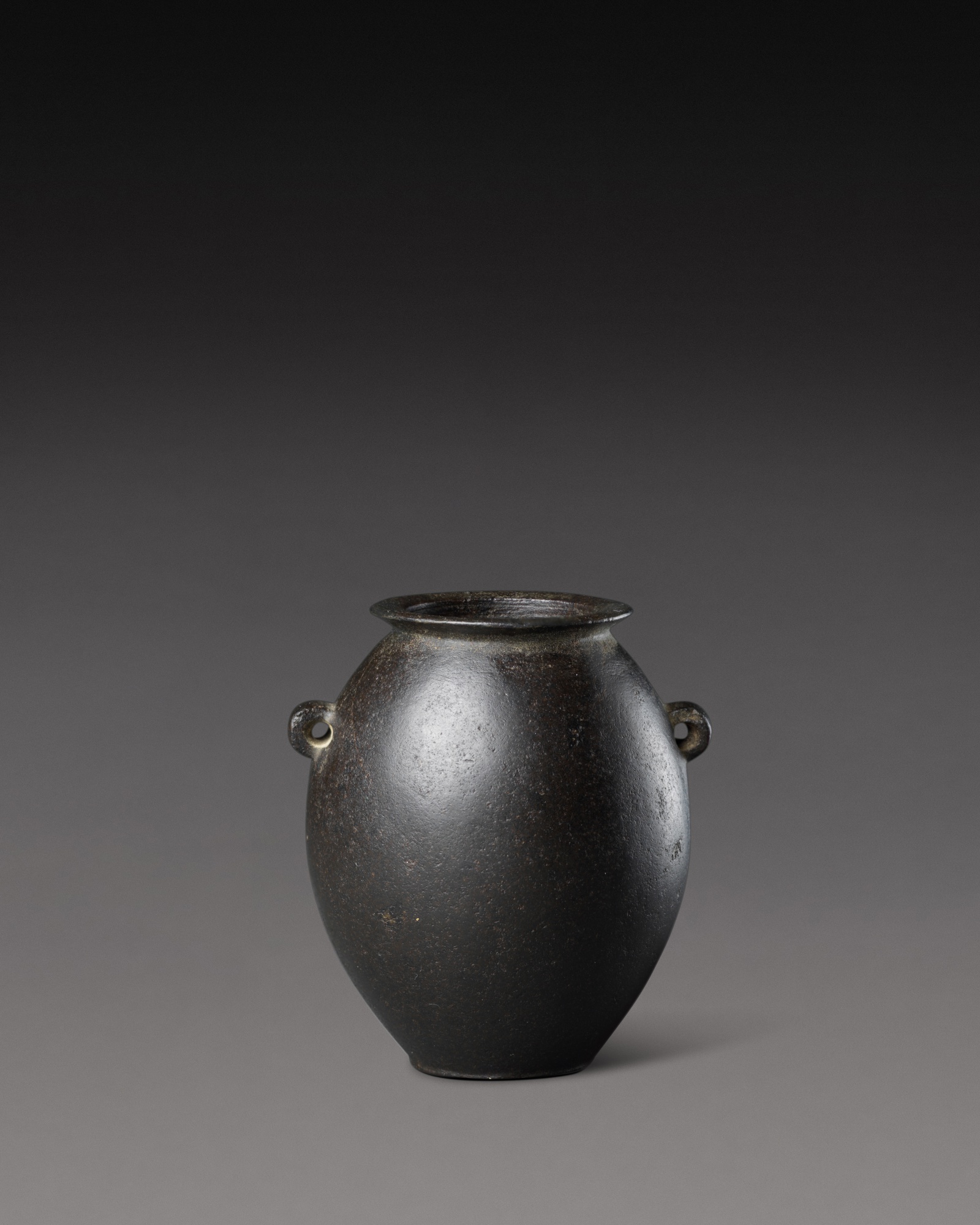 An Egyptian Basalt Jar, Predynastic Period (Nagada II)/ 1st Dynasty — An Egyptian Basalt Jar, Predynastic Period (Nagada II)/ 1st Dynasty, circa 3500-2900 B.C.