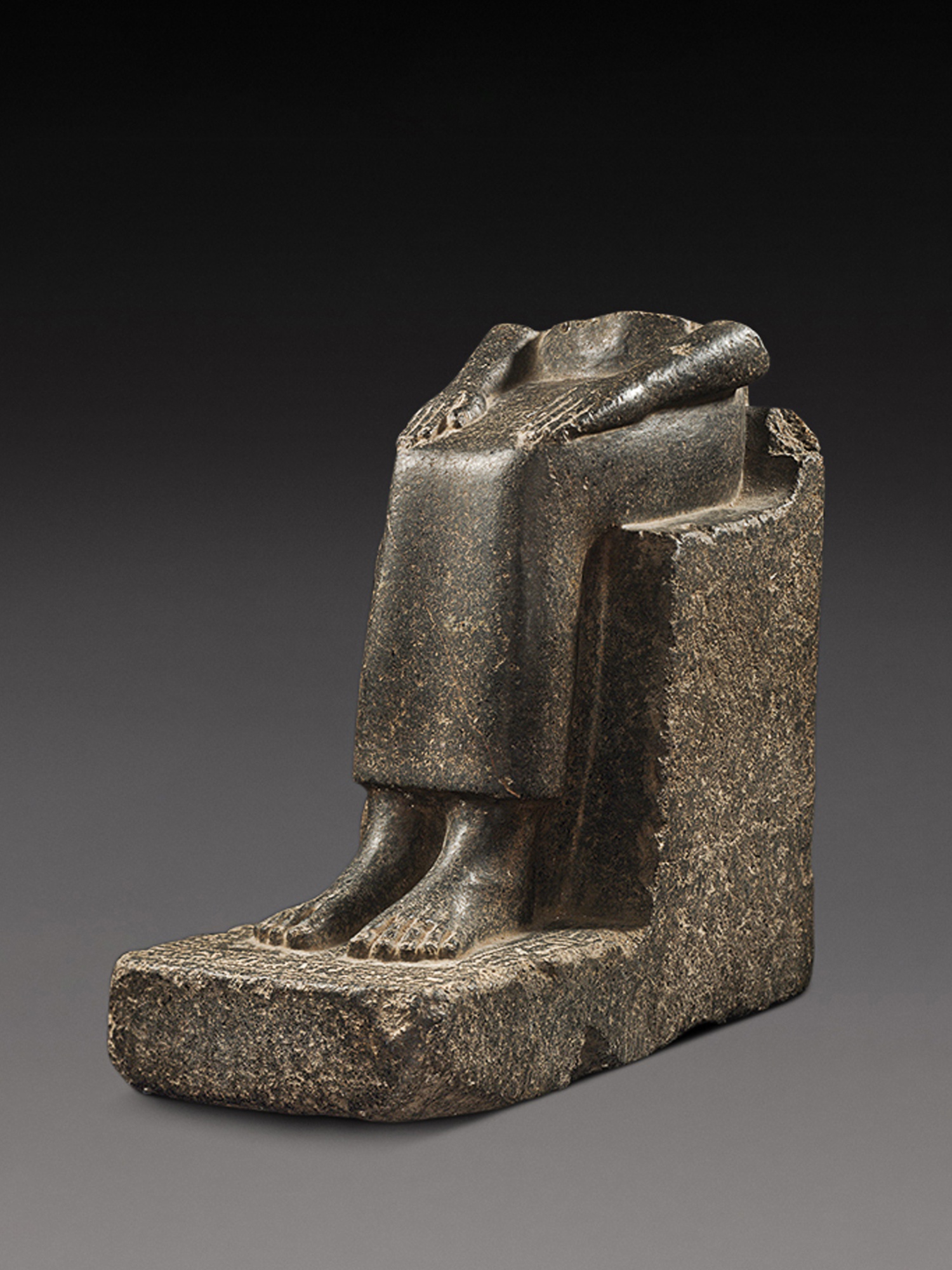 An Egyptian Granite or Basalt Statue of the King’s Sister Princess Sat-hathor — An Egyptian Granite or Basalt Statue of the King’s Sister Princess Sat-hathor, 13th Dynasty, 1759-1640 B.C.