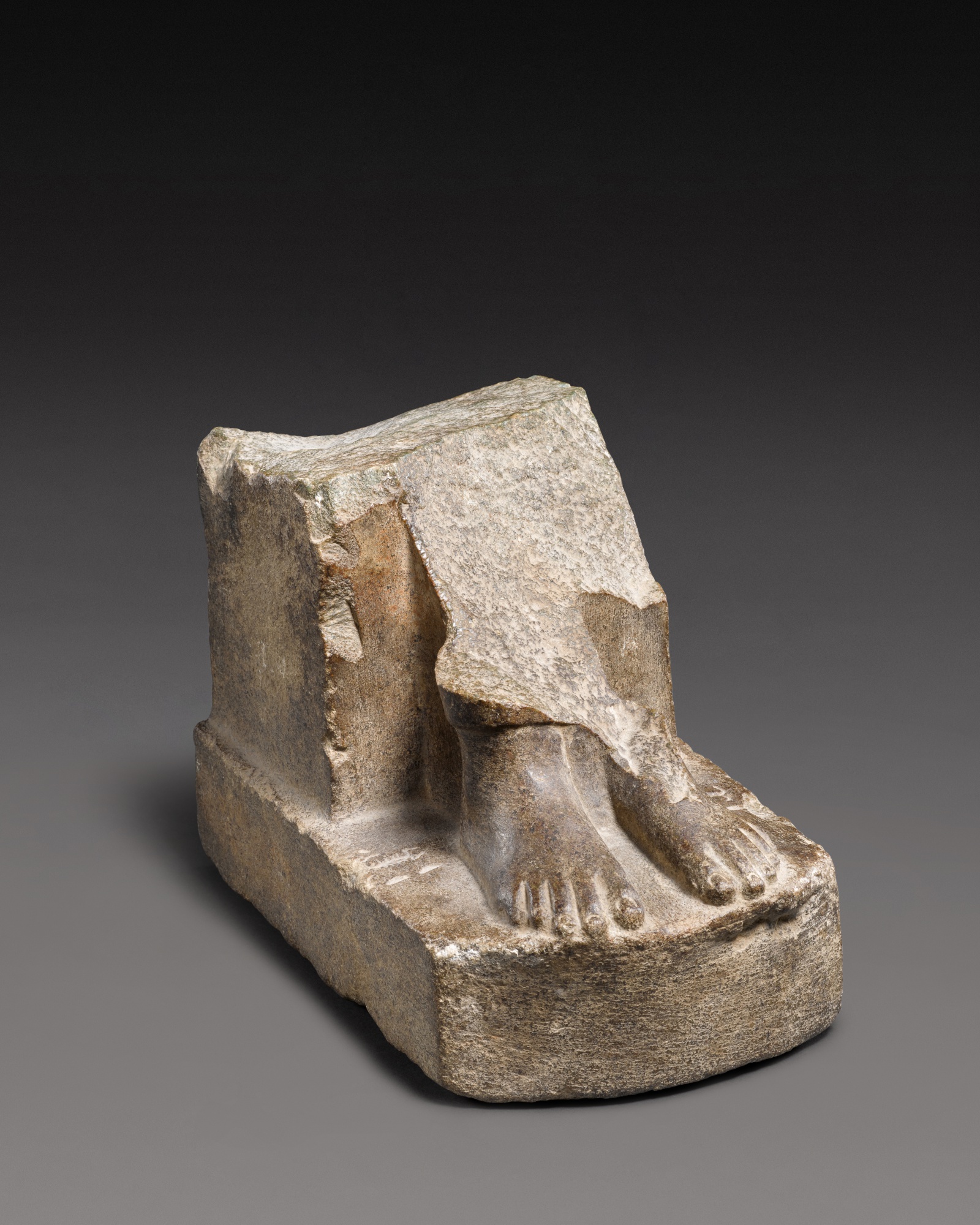 Another Property — An Egyptian Basalt Statue Fragment, Late Period, 712-30 B.C., or earlier