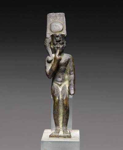 An Egyptian Bronze Figure of Harpocrates