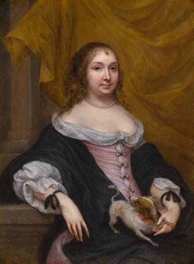 Portrait of a young woman with a dog
