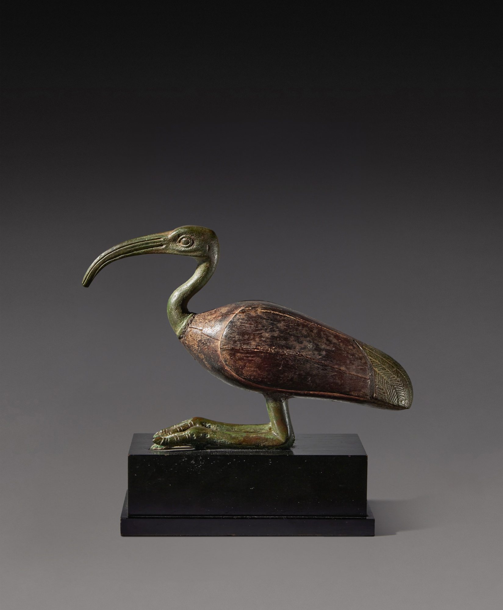 An Egyptian Bronze and Wood Figure of an Ibis — An Egyptian Bronze and Wood Figure of an Ibis, Late Period, 716-30 B.C.