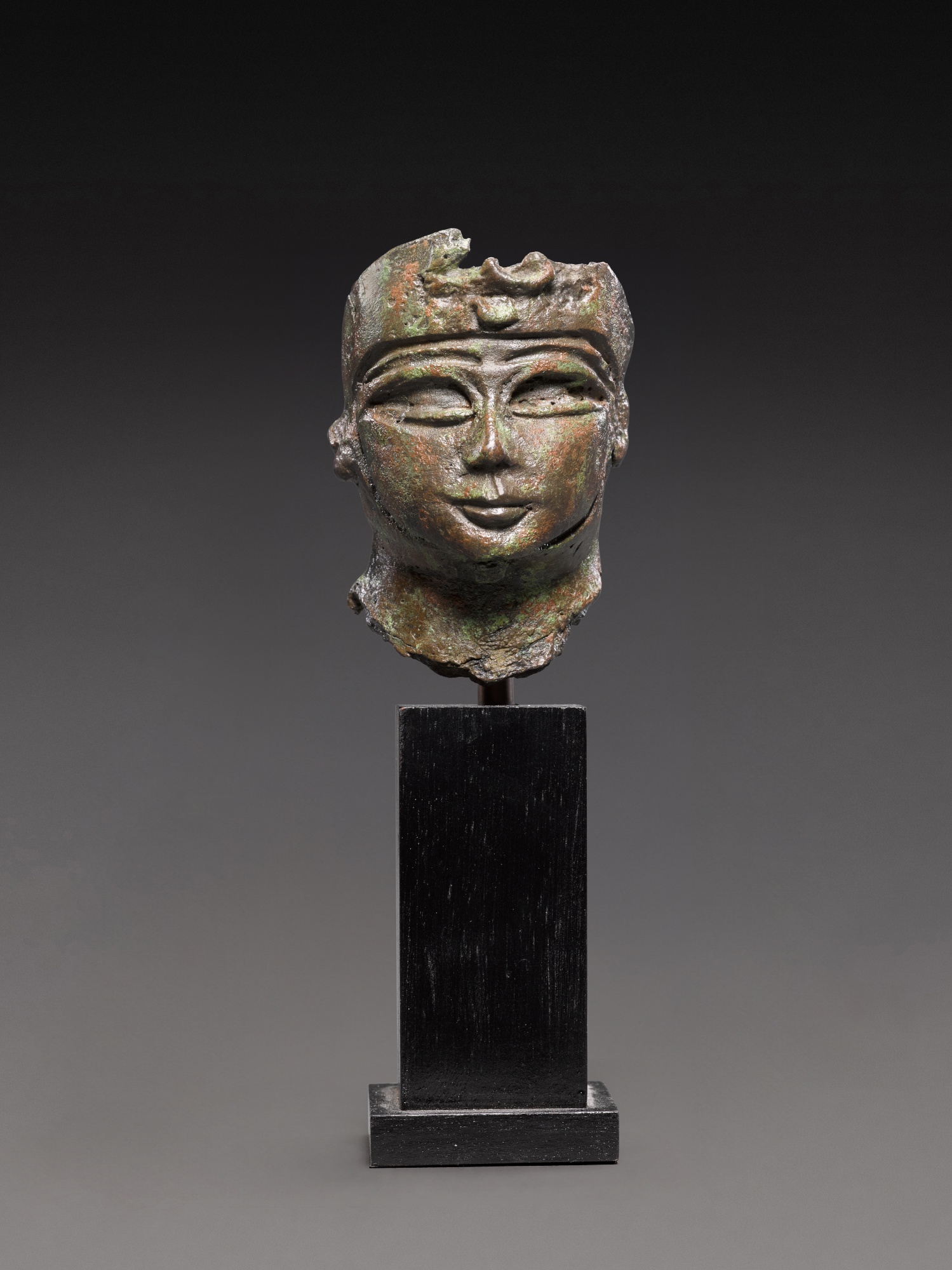 An Egyptian Bronze Head of a Divinity or Ruler — An Egyptian Bronze Head of a Divinity or Ruler, 21st/22nd Dynasty, 1080-720 B.C.