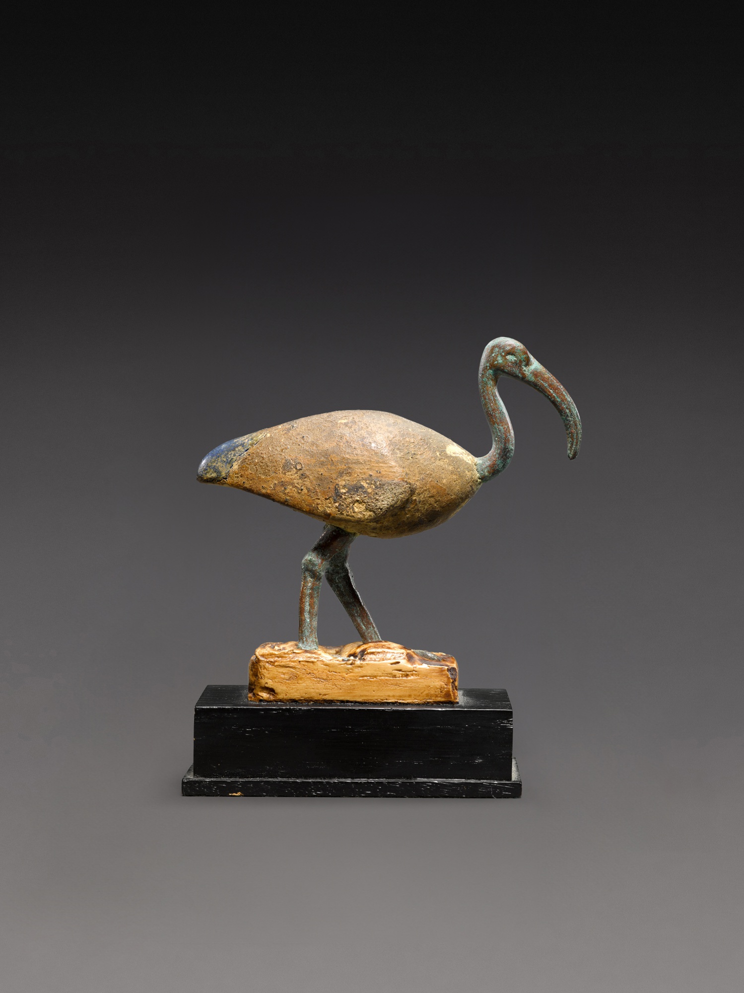 An Egyptian Bronze, Wood and Lapis Lazuli Figure of an Ibis — An Egyptian Bronze, Wood and Lapis Lazuli Figure of an Ibis, Late Period, 664-30 B.C.