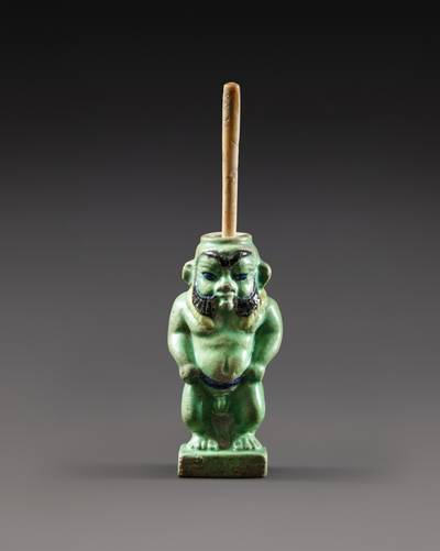 An Egyptian Polychrome Faience Cosmetic Vessel