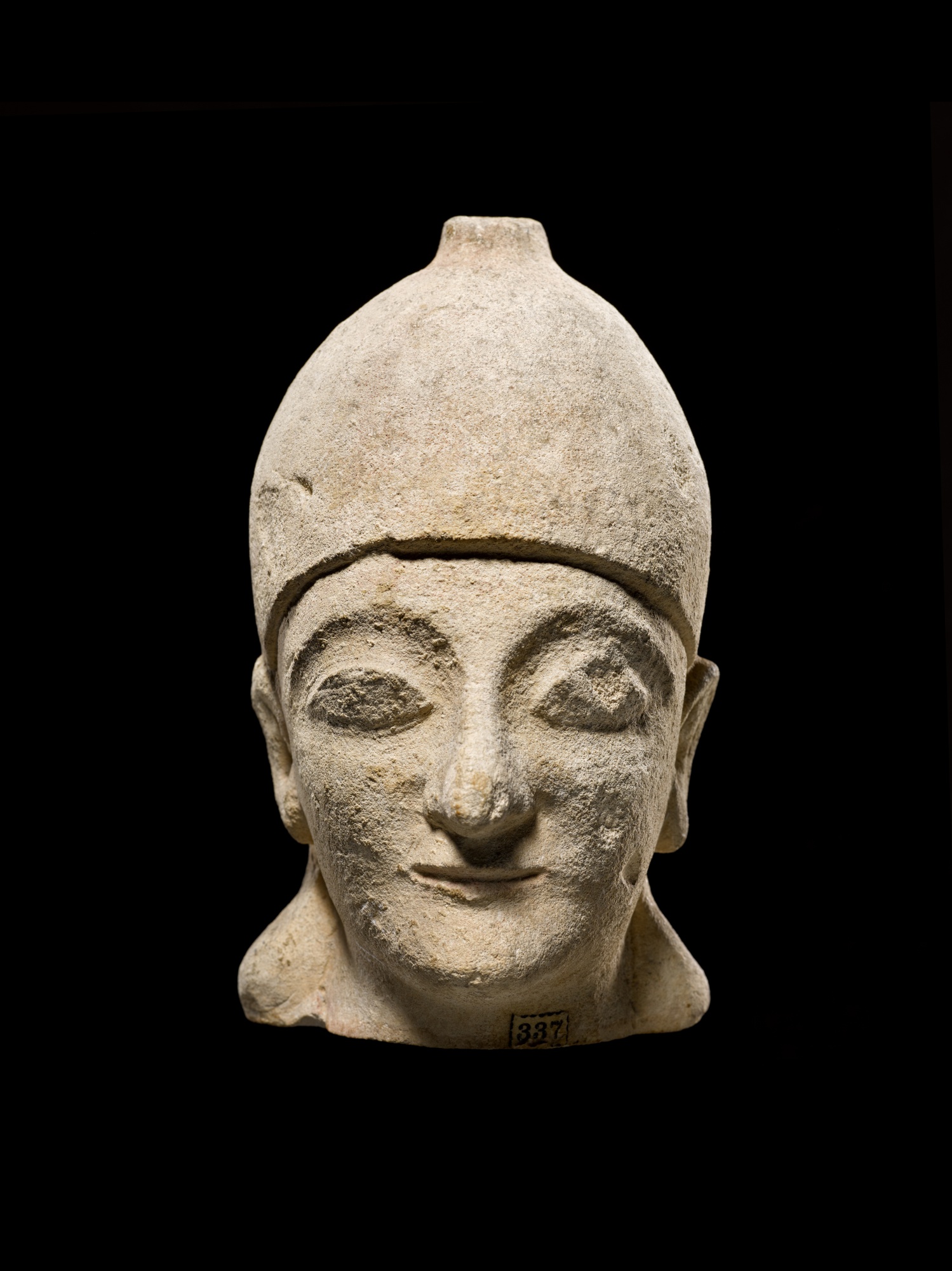 A Cypriot Limestone Head of a Priest or Votary — A Cypriot Limestone Head of a Priest or Votary, circa 1st half of the 5th Century B.C.
