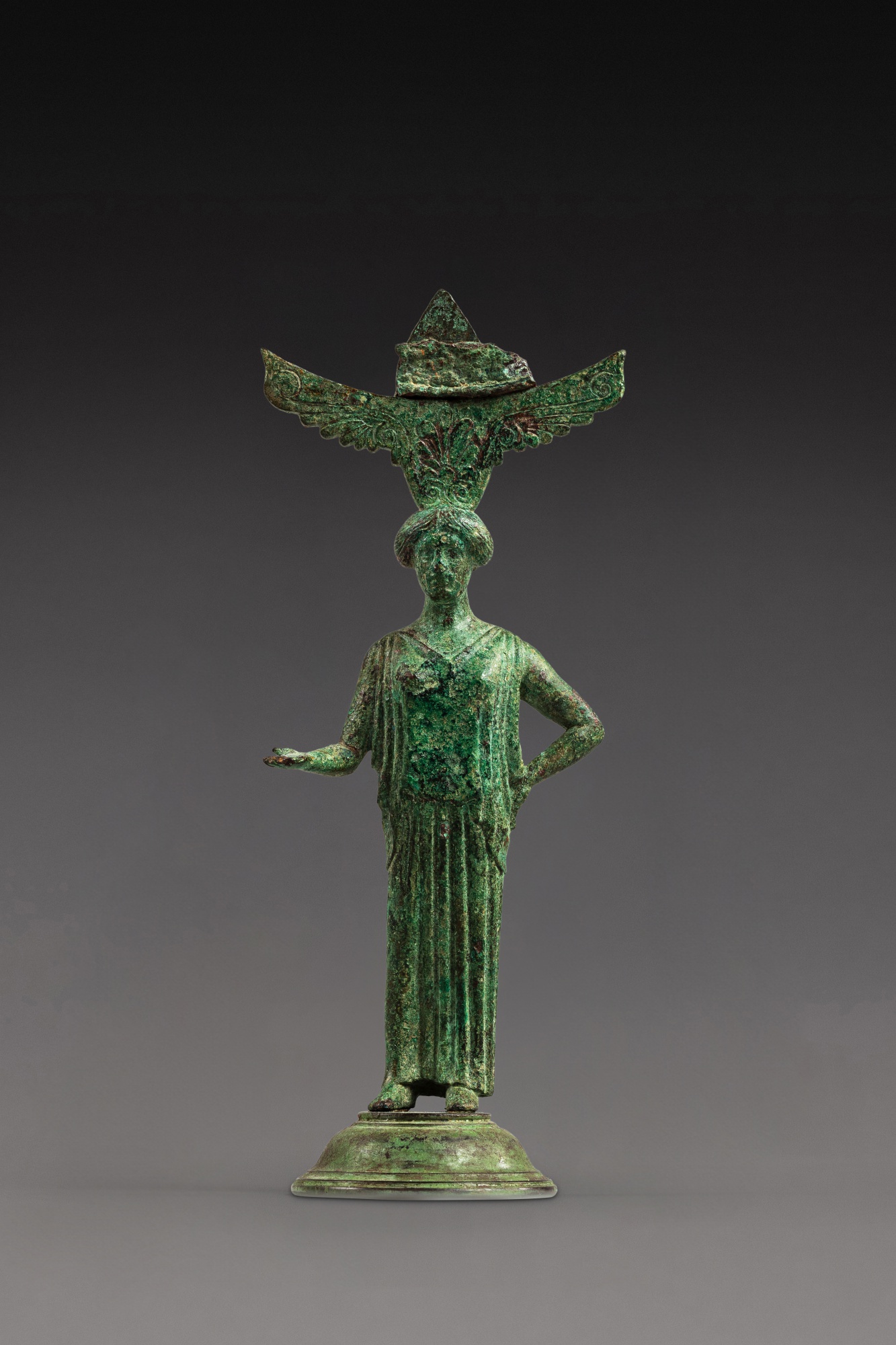 A Greek Bronze Mirror Handle — A Greek Bronze Mirror Handle, circa mid 5th Century B.C. 