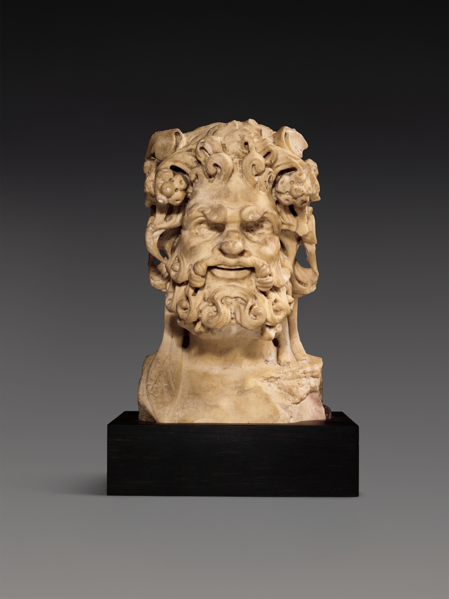 Unknown — A Roman Giallo Antico Marble Herm bust of Silenus, circa 2nd Century A.D.