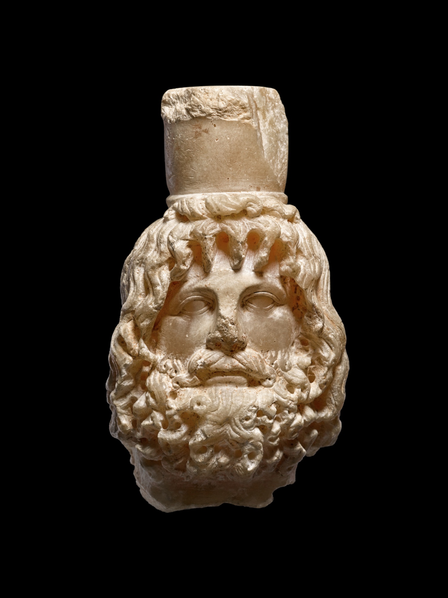 Unknown — A Roman Alabaster Head of Sarapis, circa 2nd Century A.D.