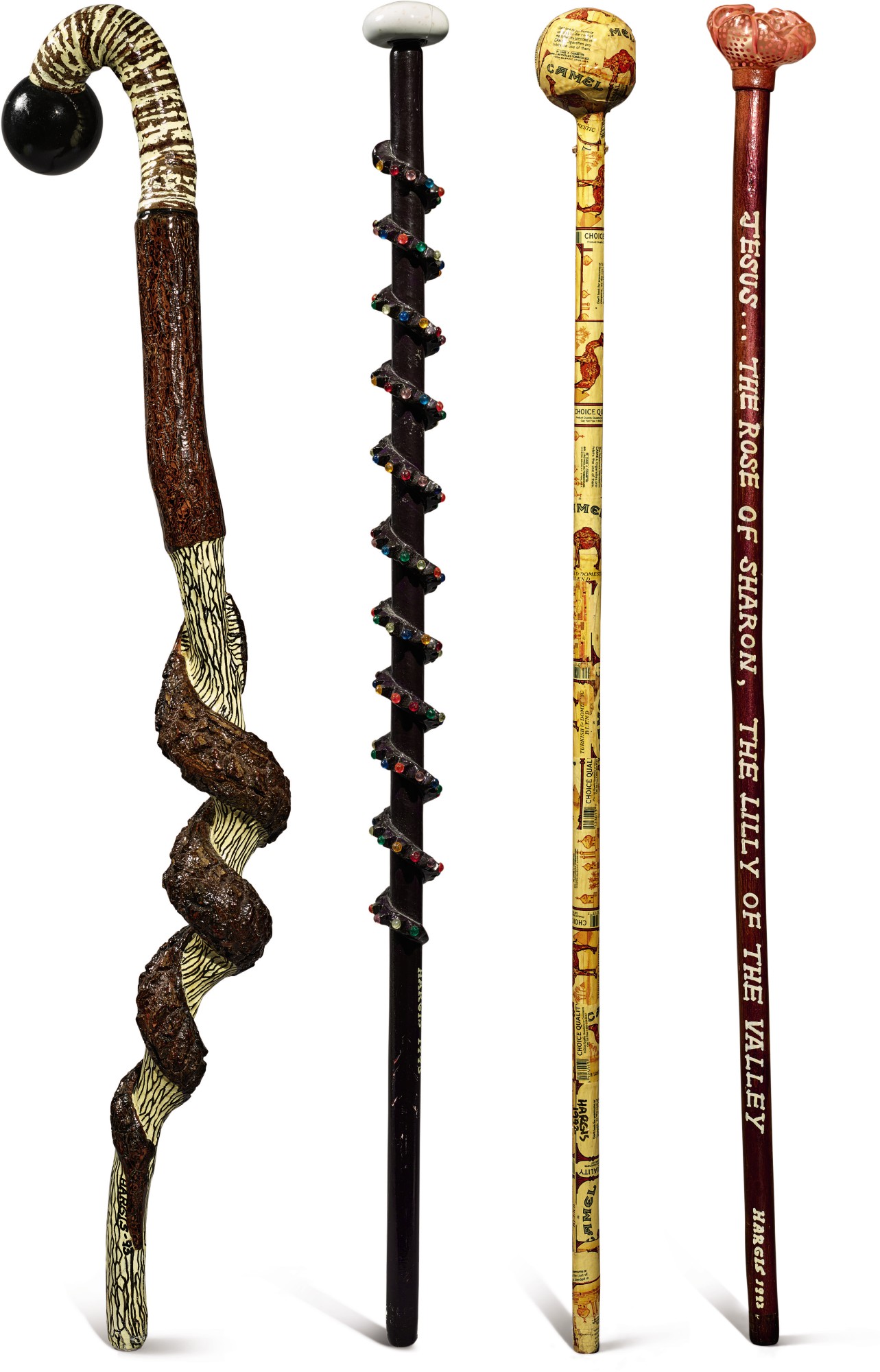 Group of Four Carved And Decorated Wooden Walking Sticks, Gary Hargis, Somerset, Kentucky, Late 20th Century — Group Of Four Carved And Decorated Wooden Walking Sticks, Gary Hargis, Somerset, Kentucky, Late 20th Century