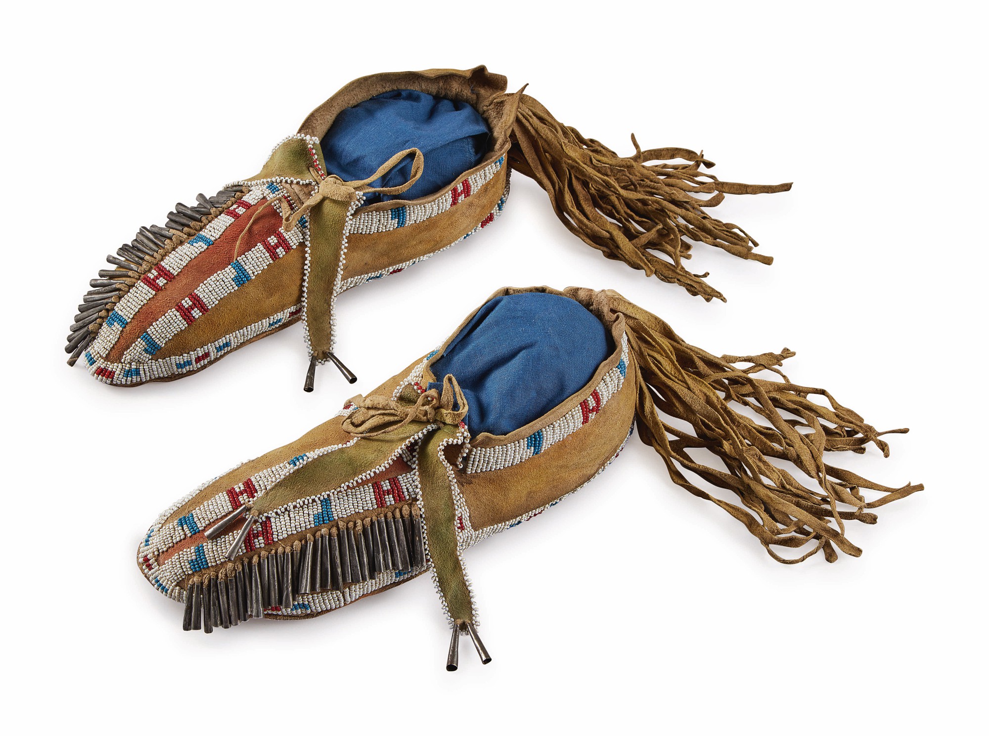 Pair of Plains Beaded, Tinned and Fringed Hide Moccasins — Pair of Plains Beaded, Tinned and Fringed Hide Moccasins