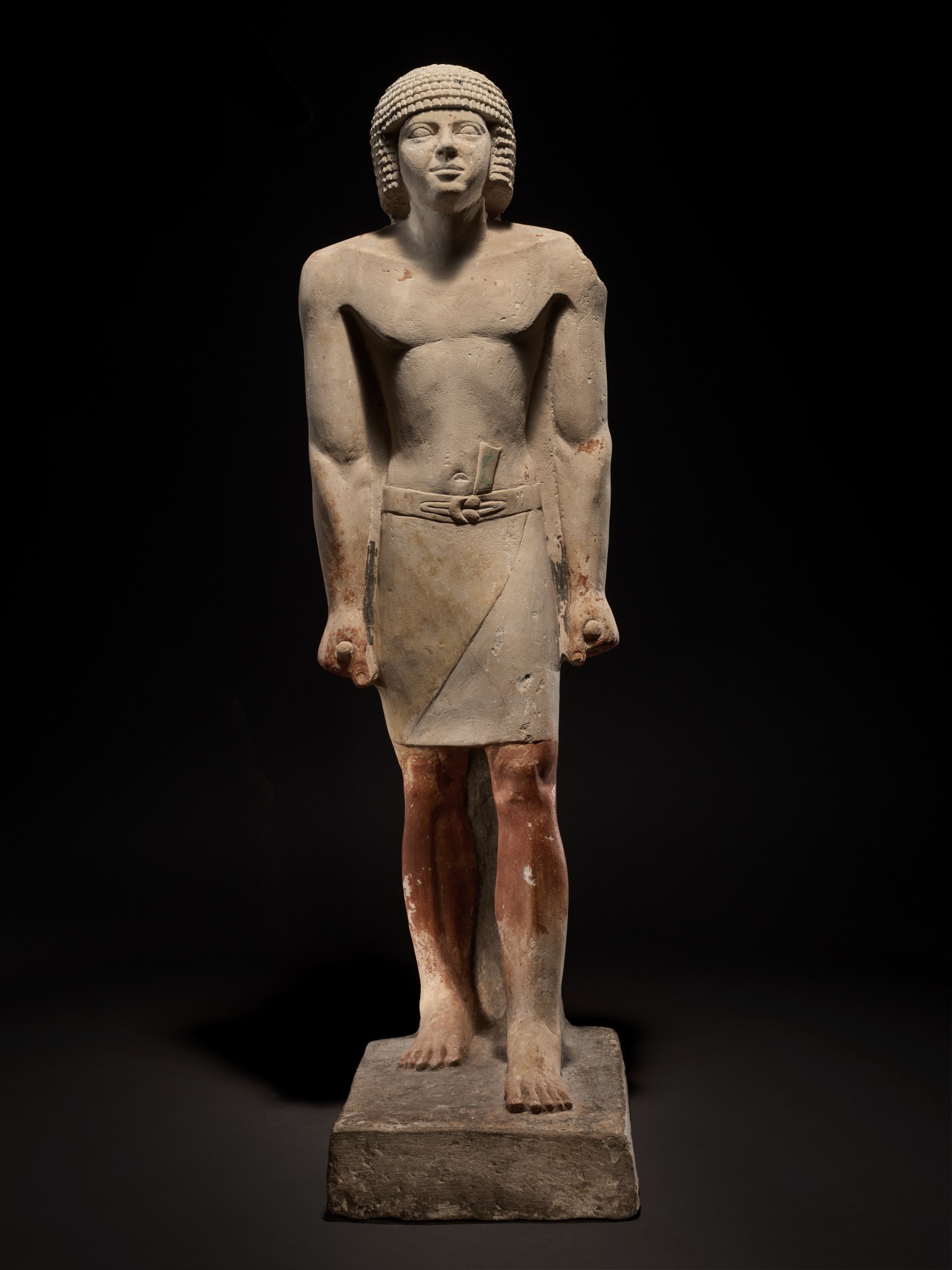 An Egyptian Limestone Figure of a Man — An Egyptian Limestone Figure of a Man, late 5th Dynasty, circa 2440-2355 B.C.