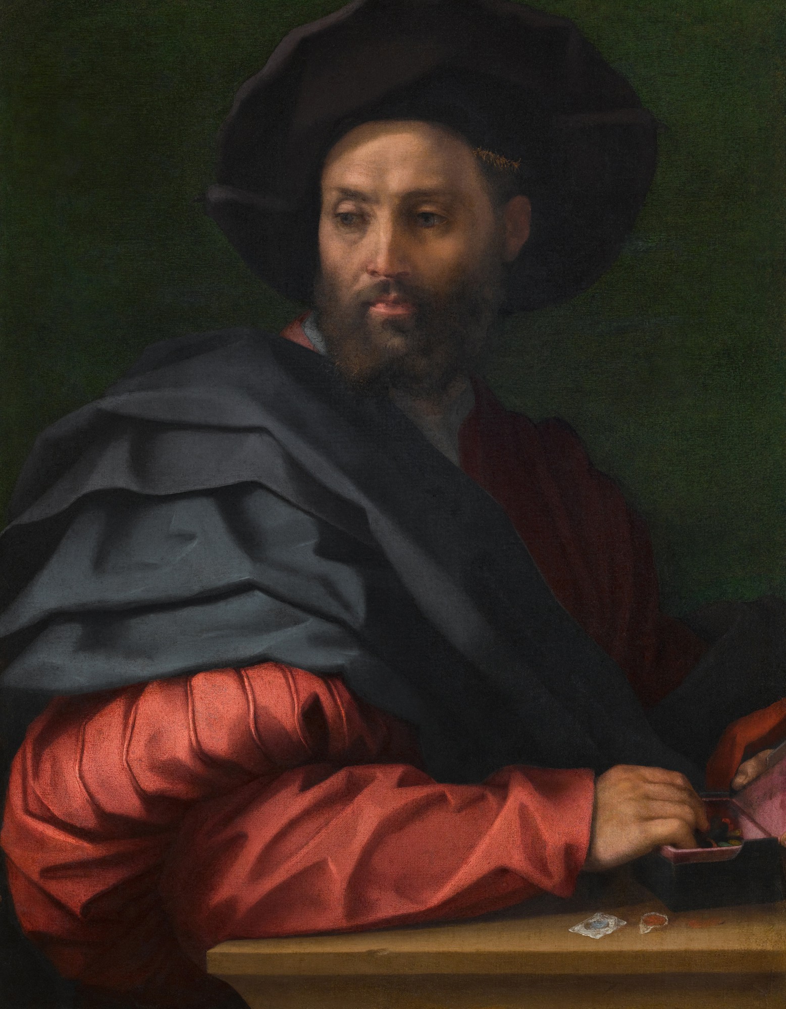 Andrea del Sarto — Portrait of a man (Ottaviano de' Medici?) wearing a large hat, with a box of wax seals resting on a ledge before him