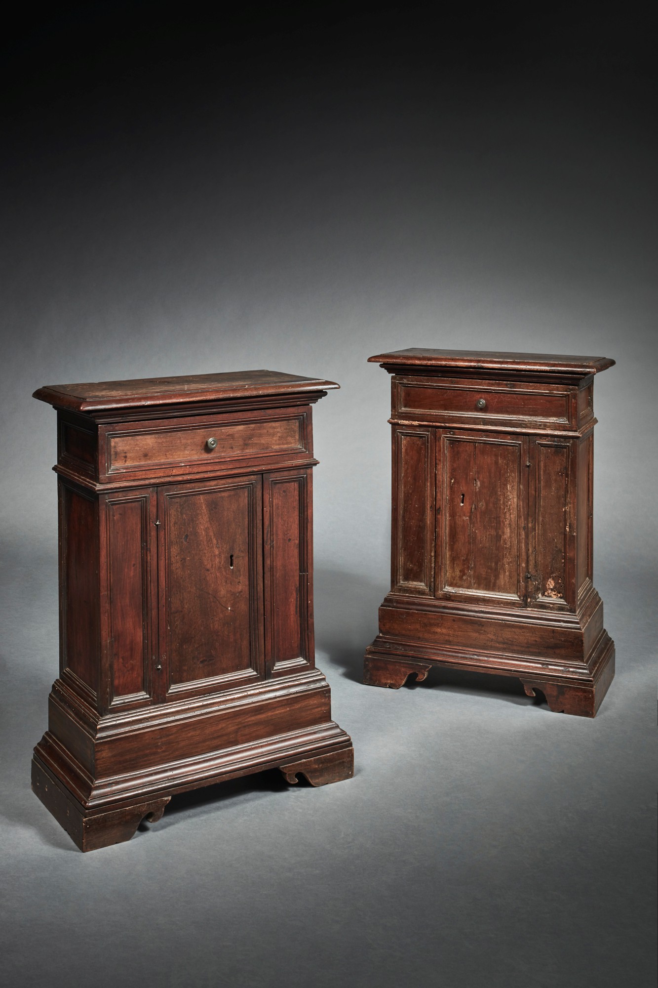 Unknown — Matched pair of Italian Renaissance carved walnut one-door credenzas Late 16th Century and later 