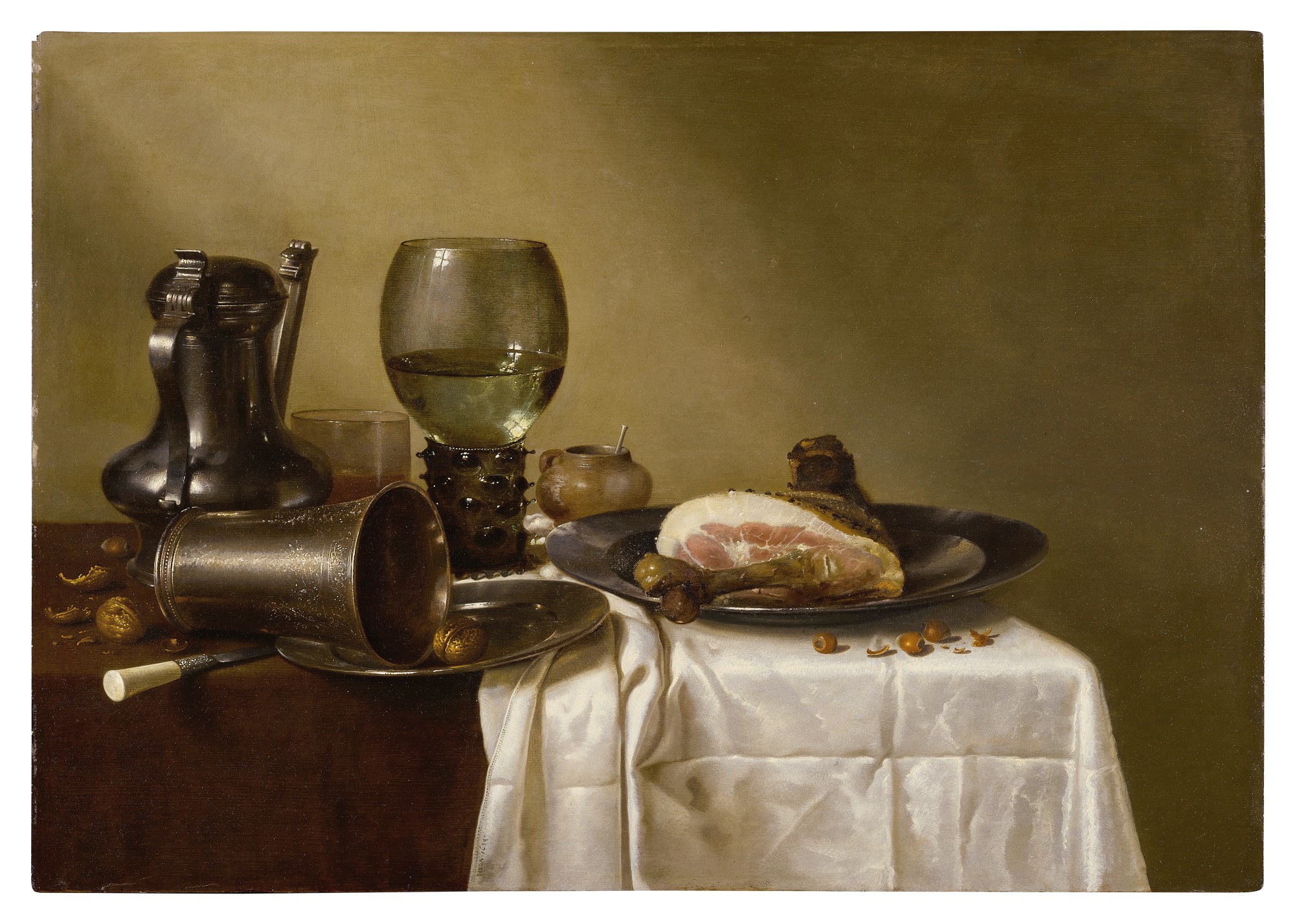 Unknown — Still life of a pewter kanne, a roemer, an overturned silver beaker resting on a pewter plate and a ham upon another pewter plate, all upon a partially draped table