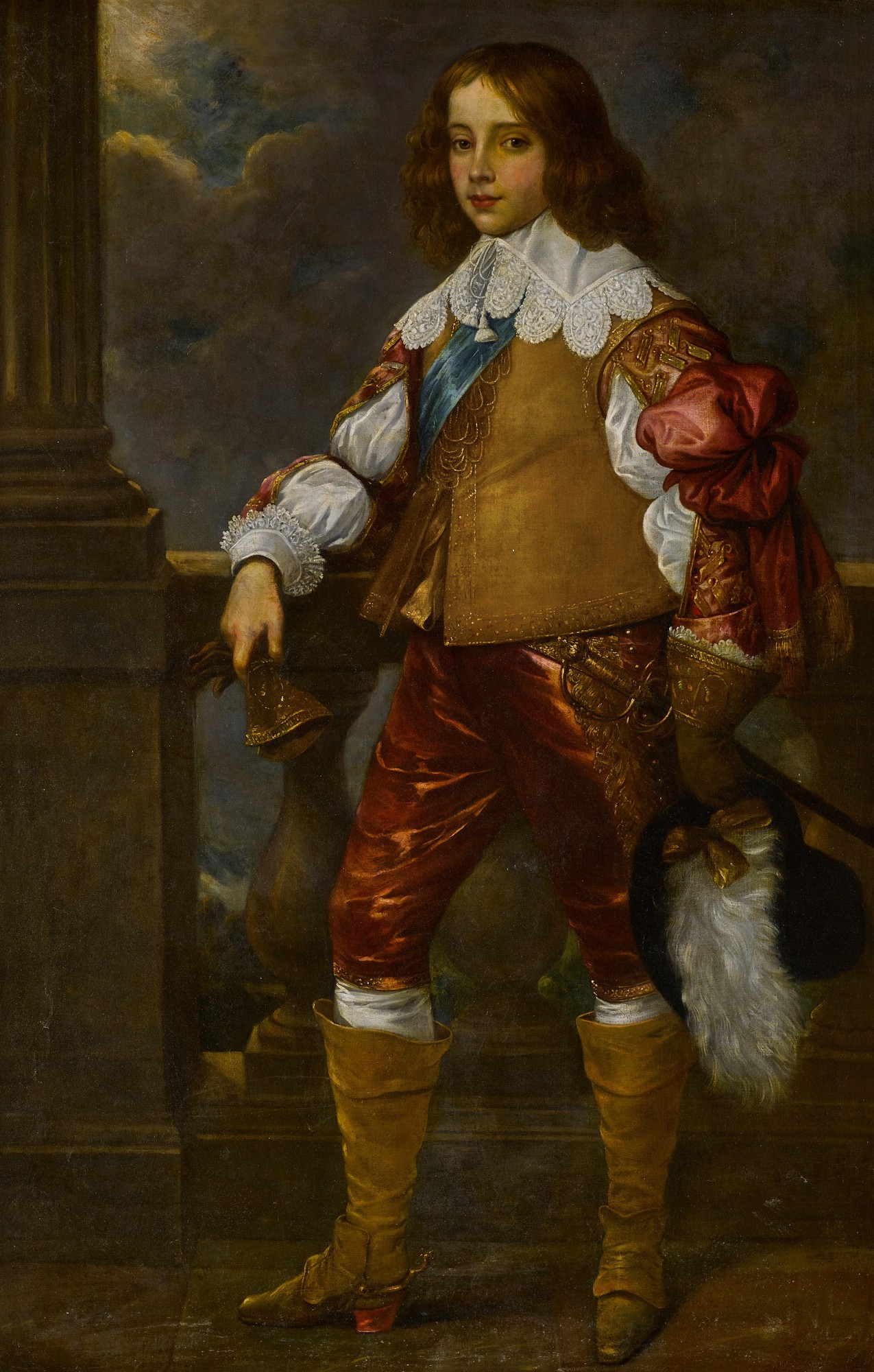 Circle of Sir Anthony van Dyck — Portrait of Charles II, while Prince of Wales, full-length, in an equestrian costume and holding a feathered hat, standing before a balustrade