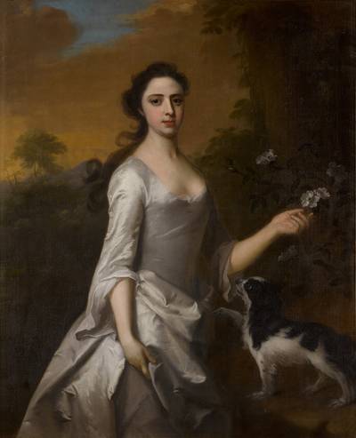 Portrait of a lady, said to be Frances Bristow, three-quarter length, in a white dress with a spaniel