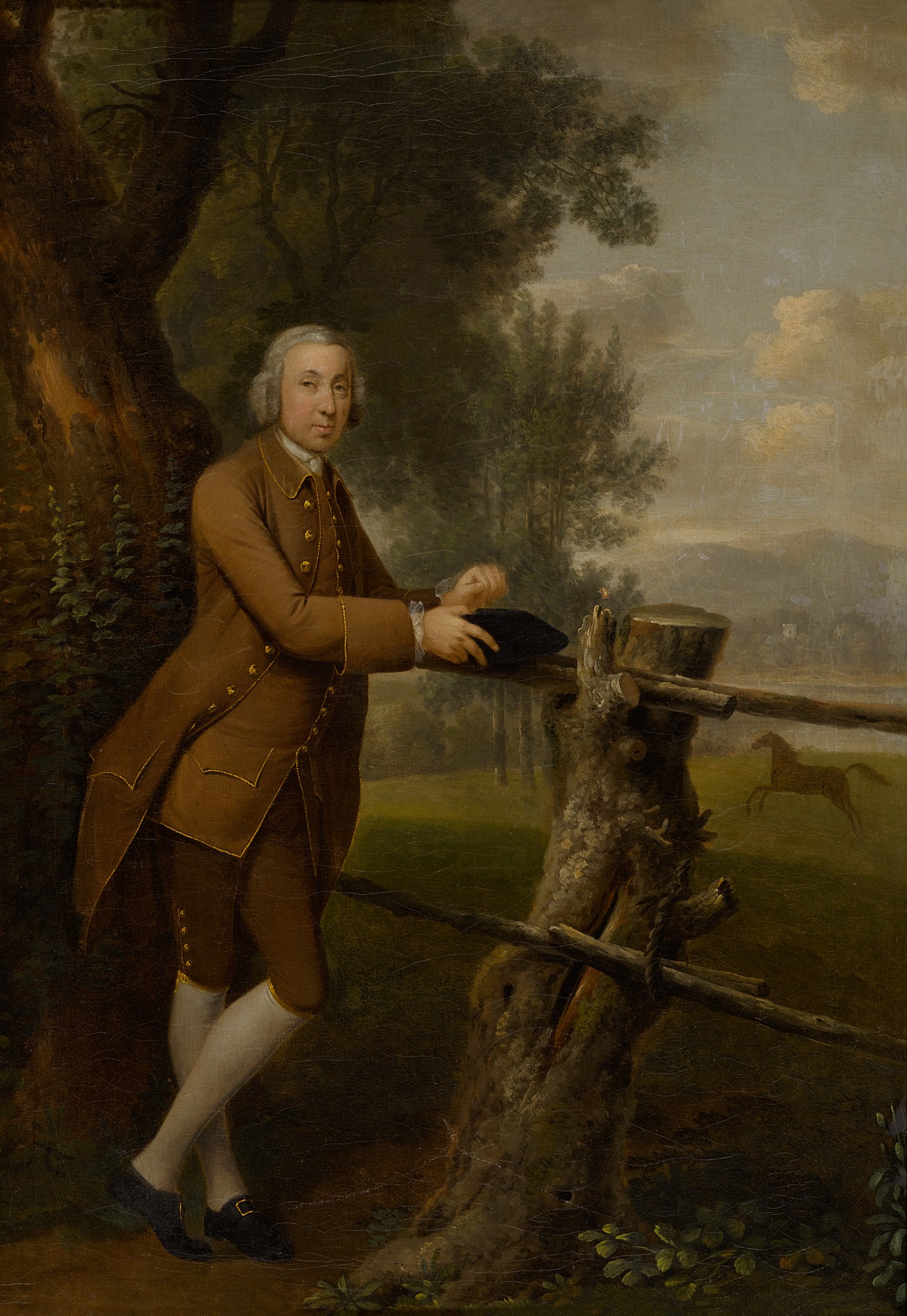 Arthur Devis — Portrait of a gentleman in a brown suit, full-length, with a horse in the field beyond