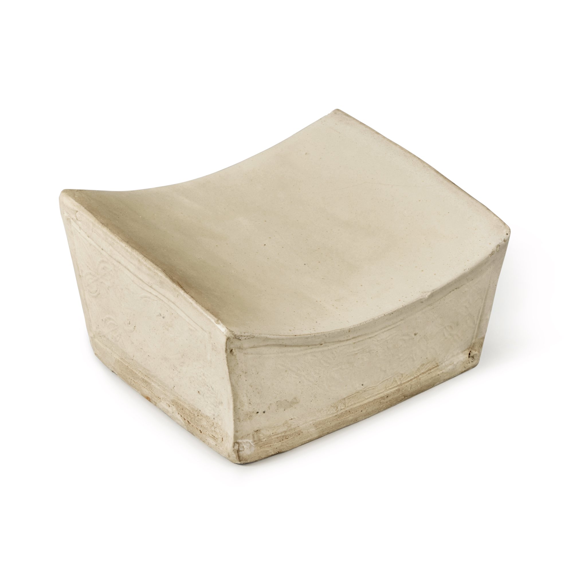 A molded white-glazed 'coins' pillow — 金 白釉印花錢紋枕