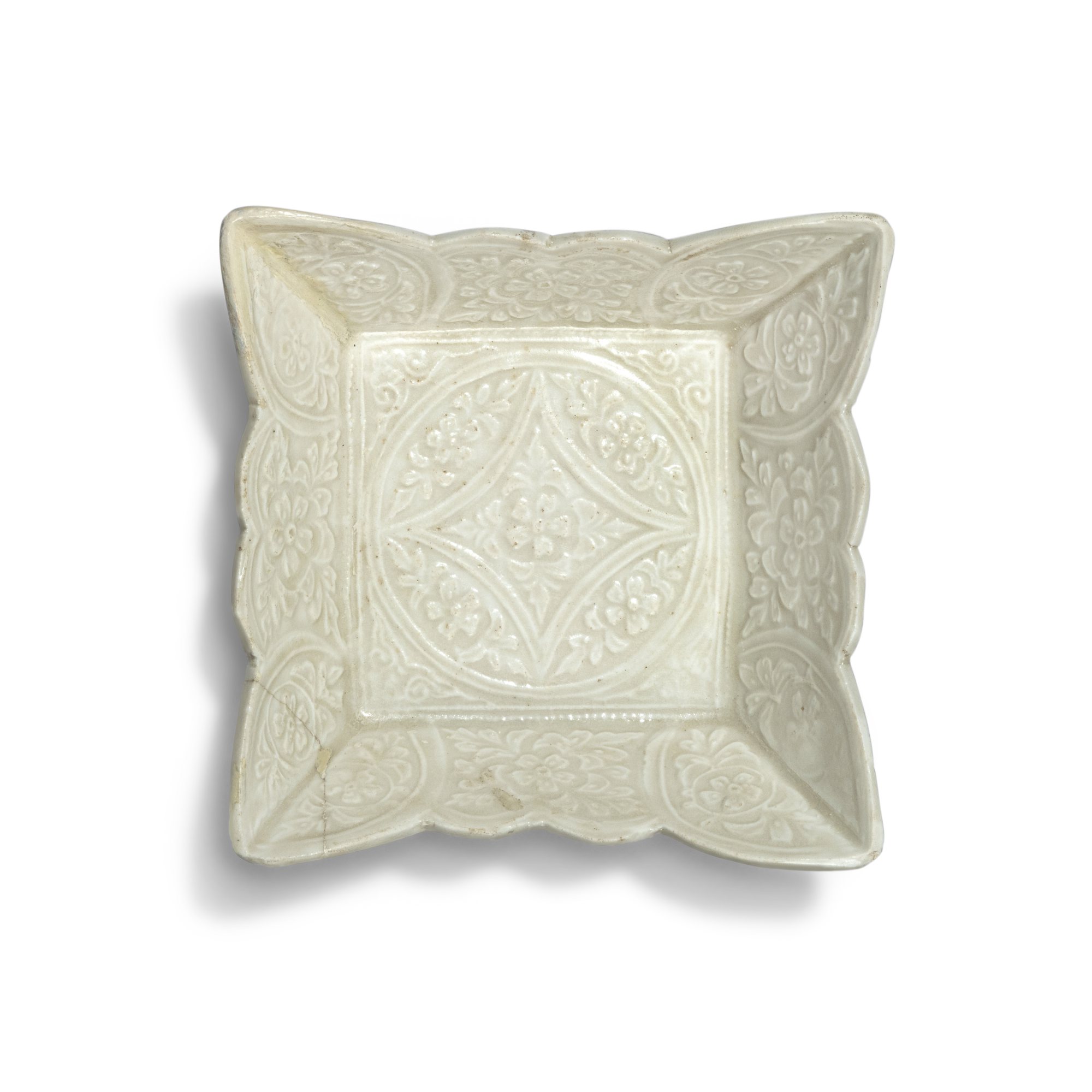 A molded white-glazed 'floral' square dish — 遼 白釉印花花口方盤