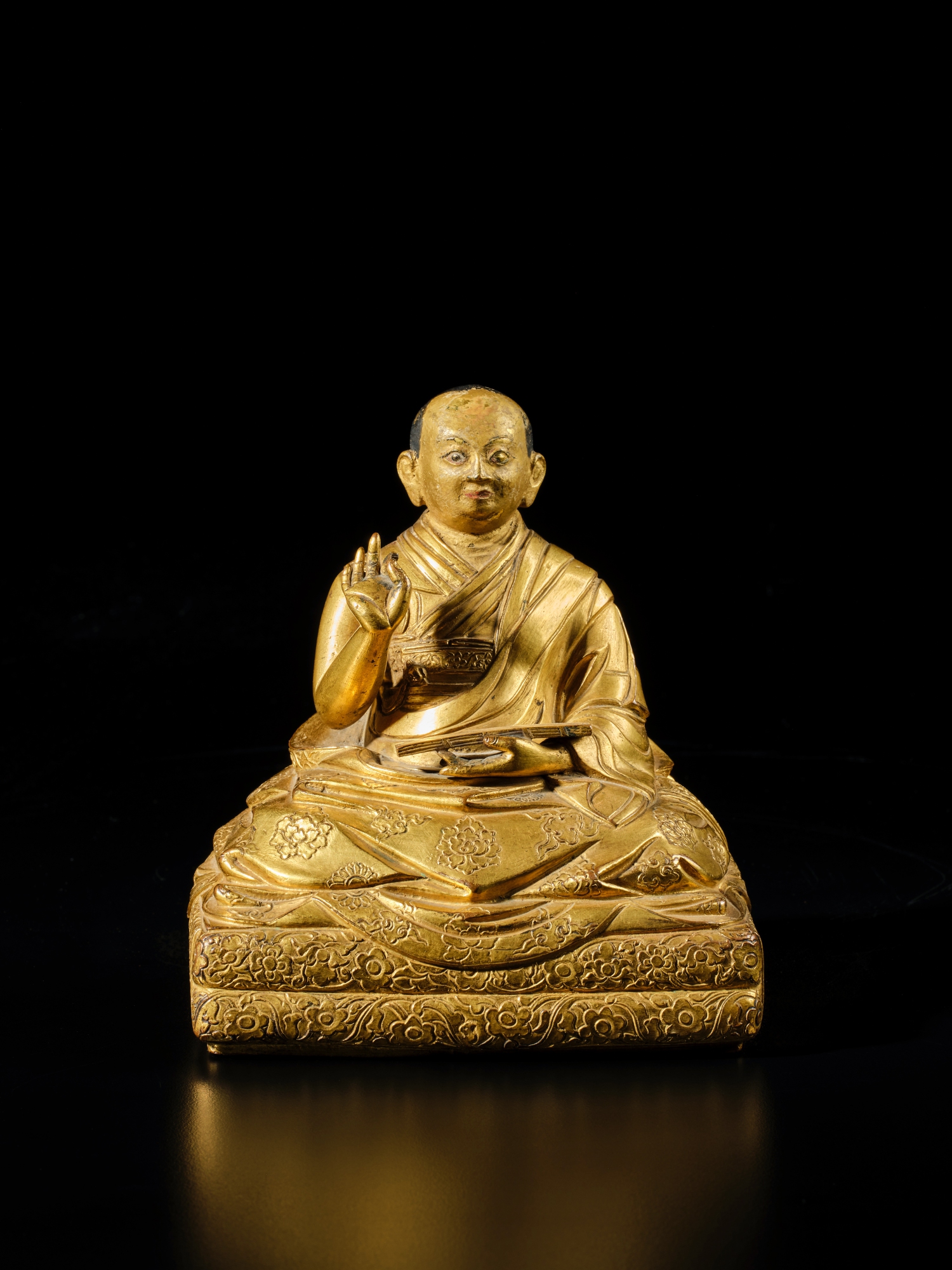 An inscribed gilt-copper alloy figure of the Fifth Dalai Lama — An inscribed gilt-copper alloy figure of the Fifth Dalai Lama, Tibet, 17th century