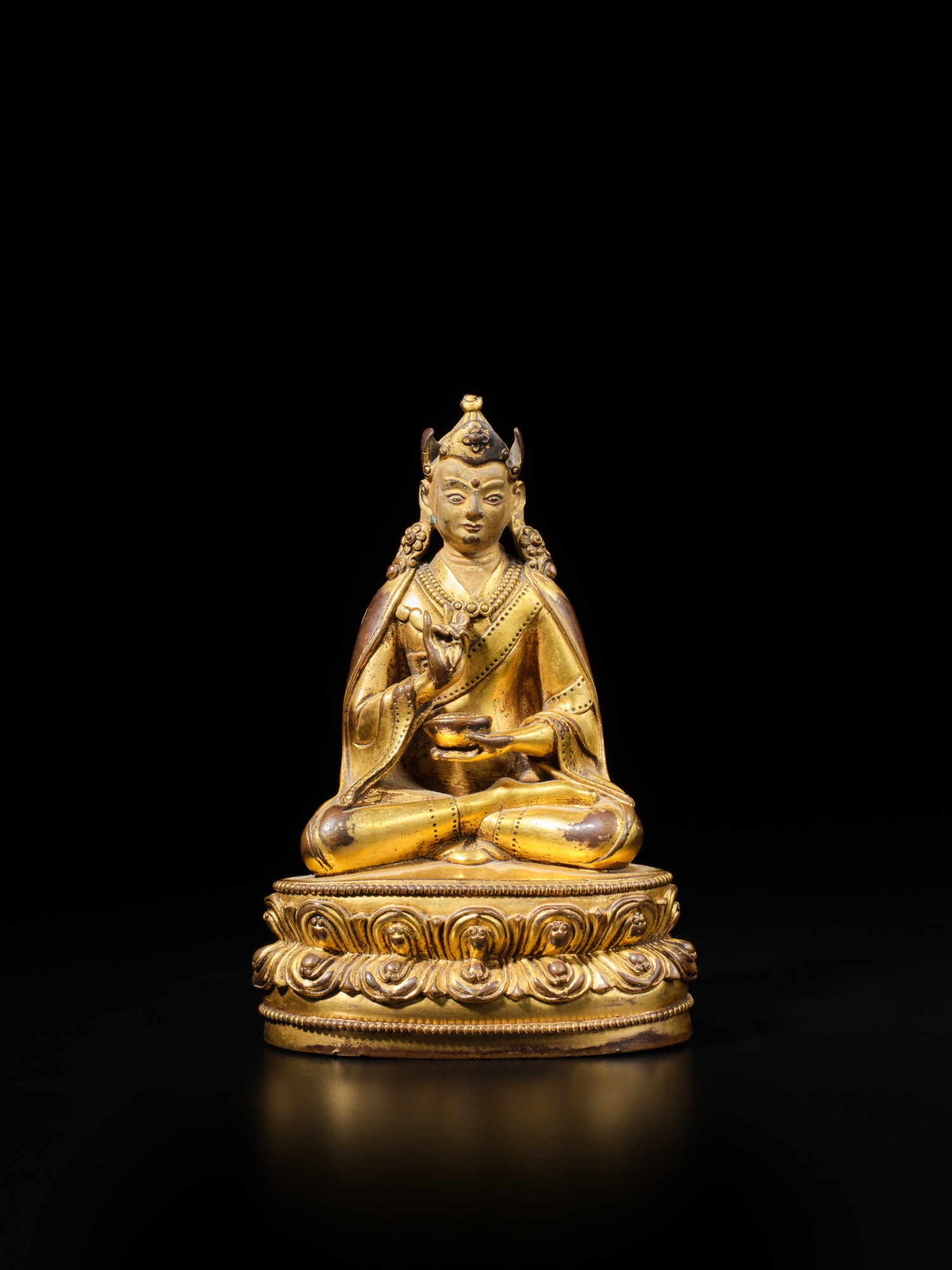 Unknown (Historical) — A gilt-copper alloy figure of Padmasambhava, Tibet, circa 16th century