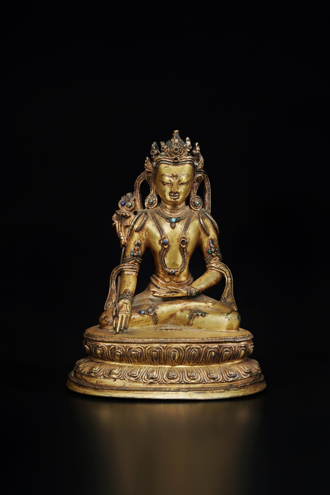 Unknown (Historical) — A gilt-copper alloy figure of Ratnasambhava, Tibet, 14th / 15th century