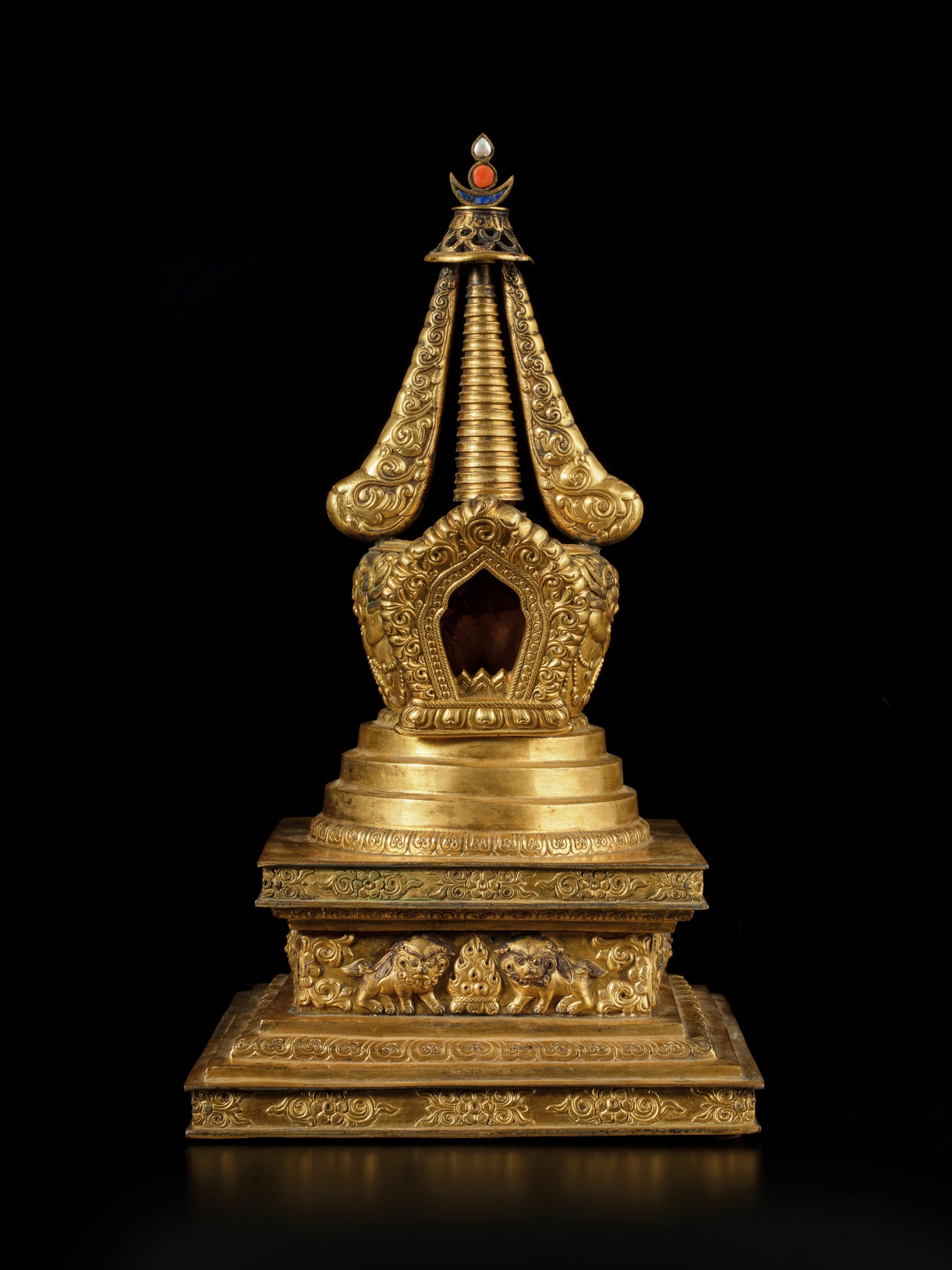 A gilt copper alloy repoussé stupa — A gilt-copper alloy repoussé stupa, Tibeto-Chinese, 18th / 19th century