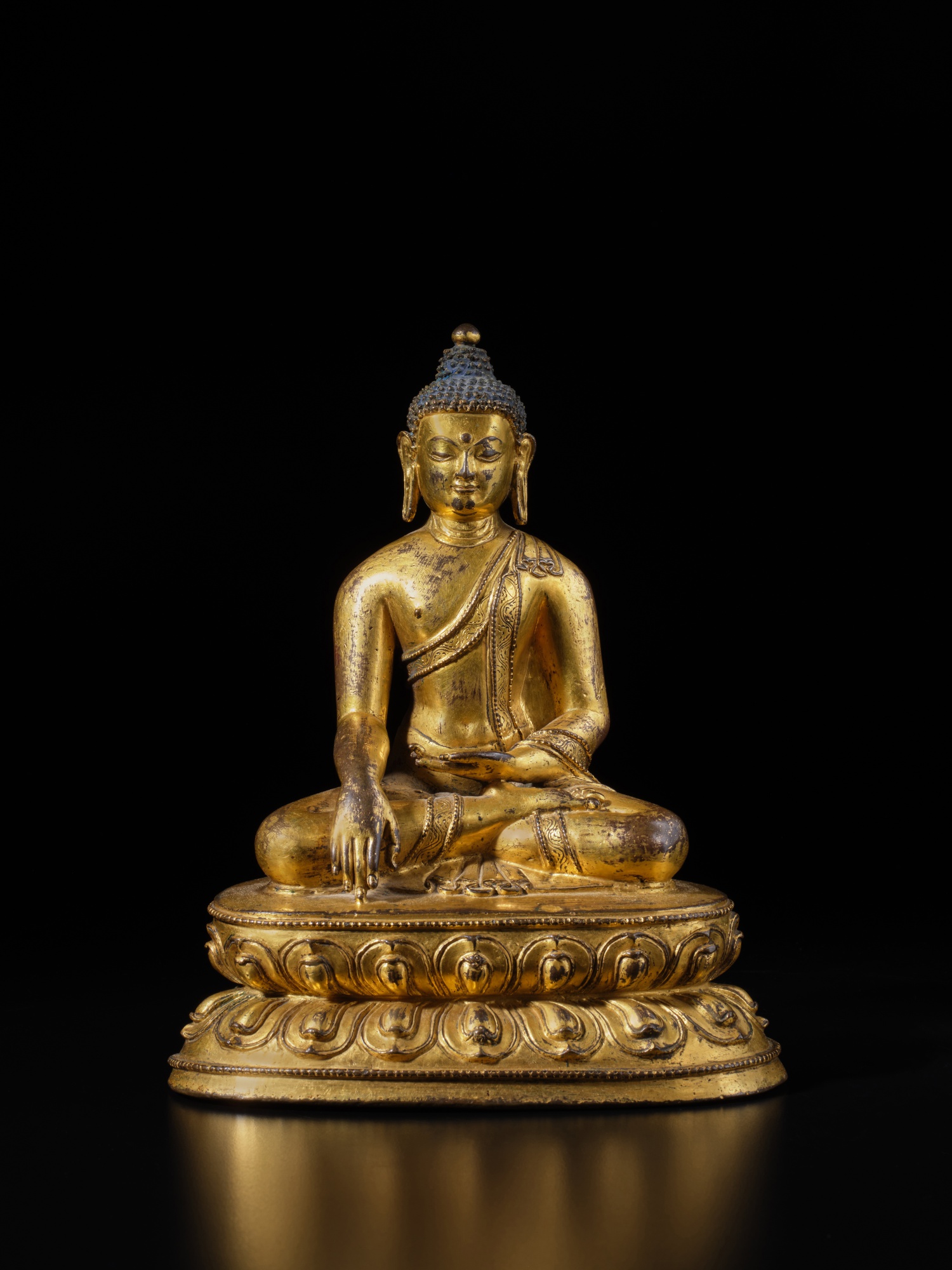 Unknown — A gilt-copper alloy figure of Shakyamuni Buddha, Tibet, 15th century