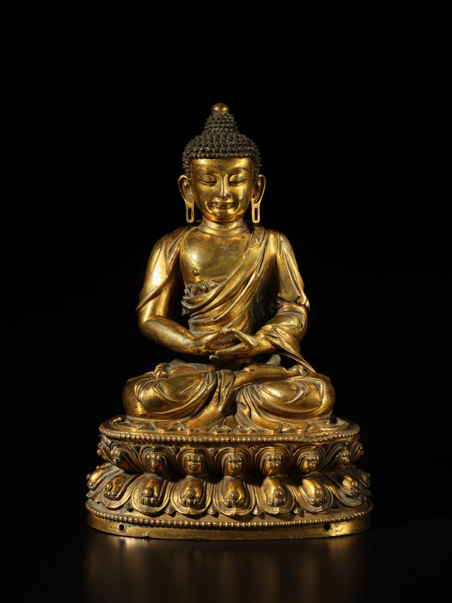 A gilt-bronze figure of Amitabha Buddha — A gilt-bronze figure of Amitabha Buddha, Ming dynasty, early 15th century